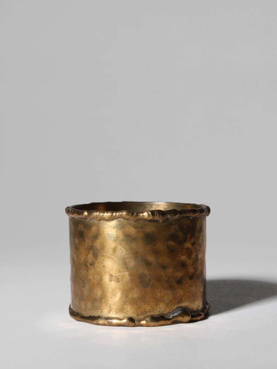 Textured Brass Napkin Rings Set — detail view