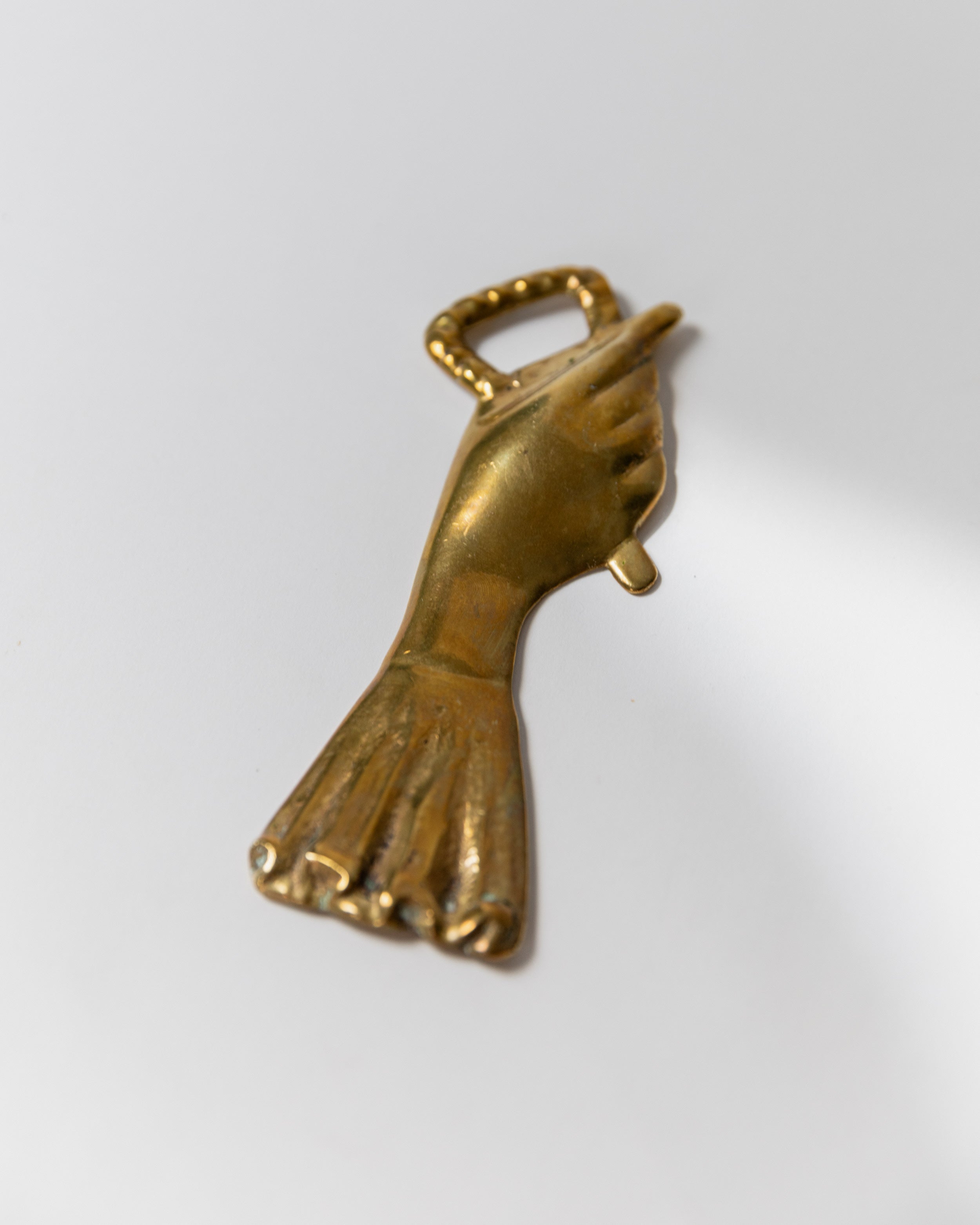 Brass bottle opener with winged hand design detail, Italy 1950s