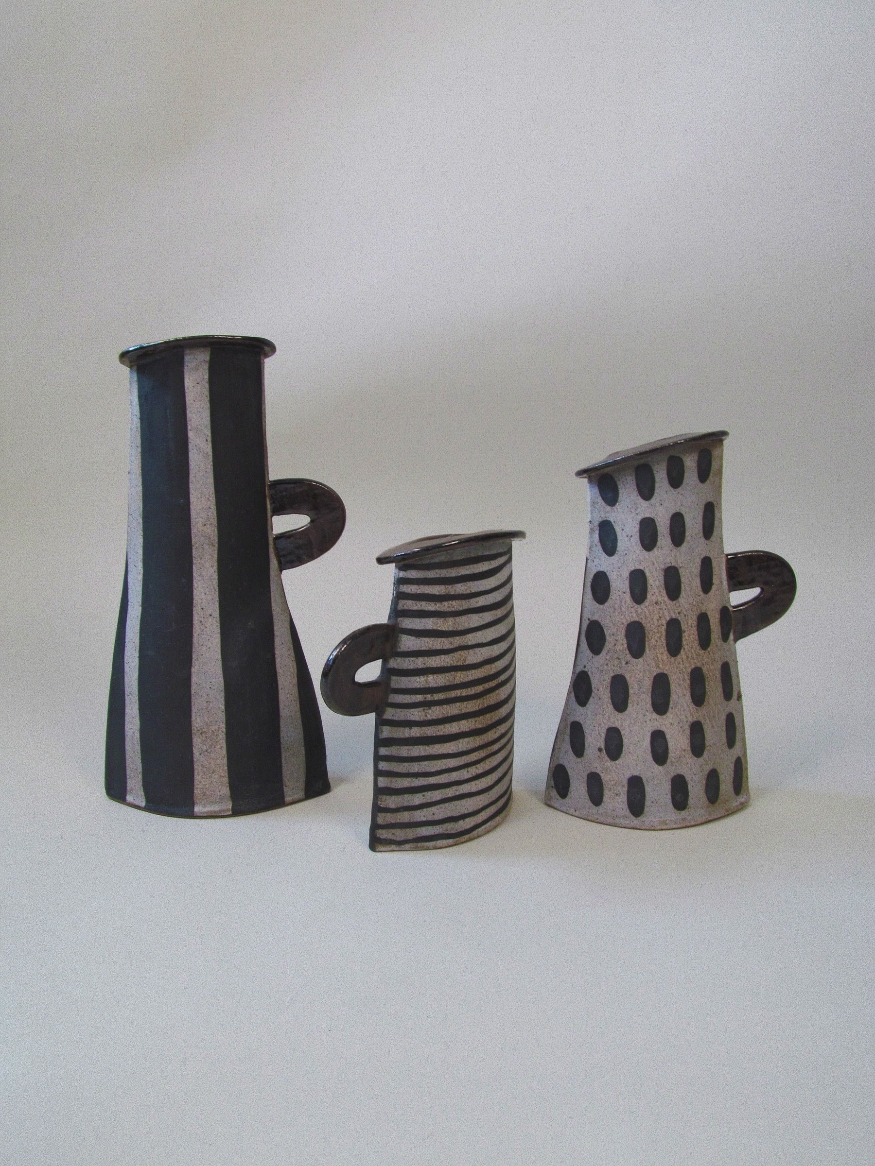 Kazuko Matthews Vases — close-up of ceramic vases with black and white patterns