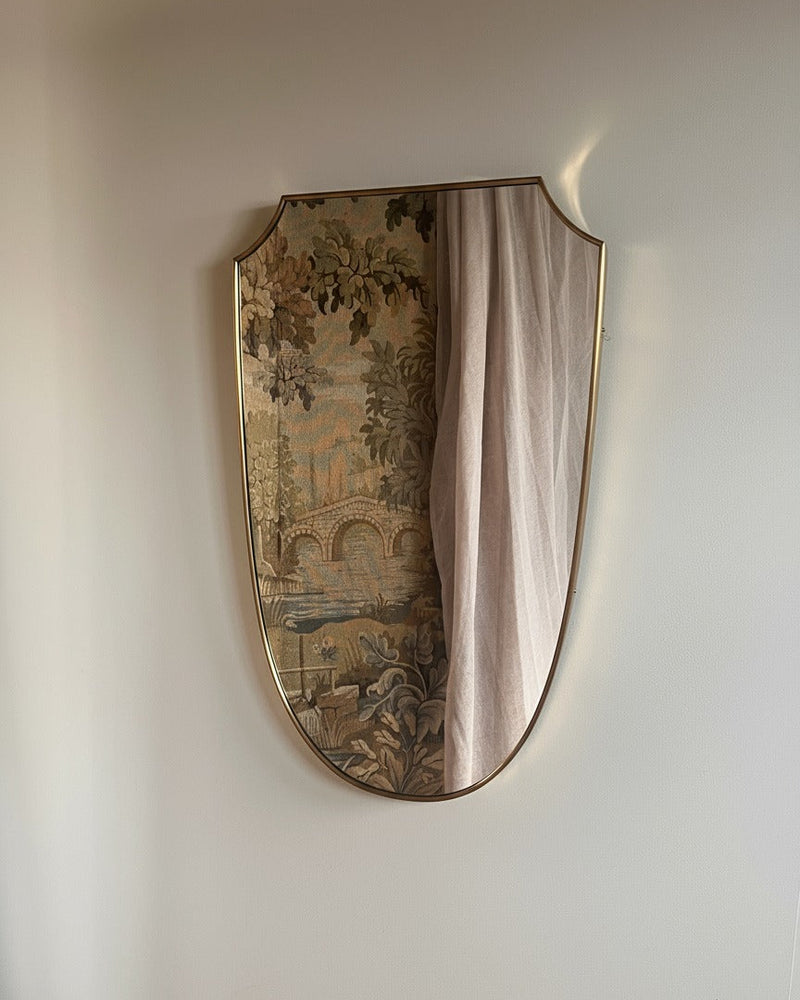 Mid-century Italian brass shield mirror with decorative tapestry inlay