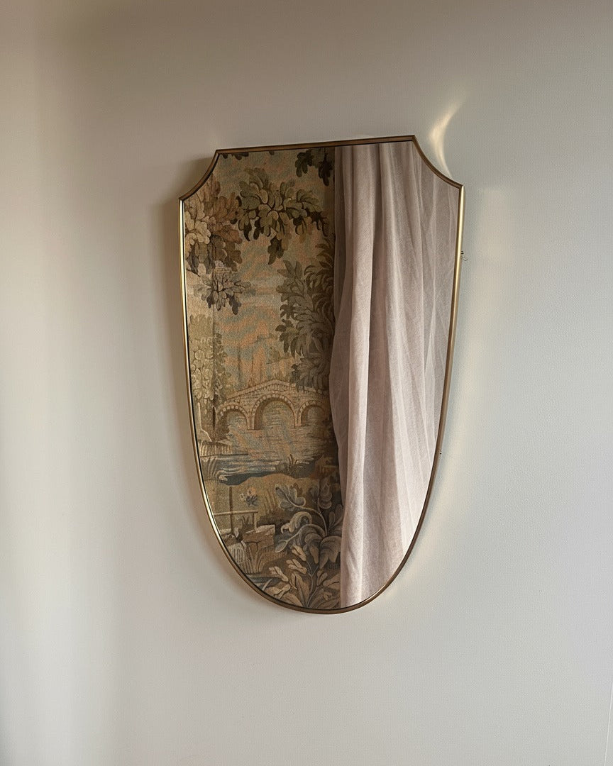 Mid-century Italian brass shield mirror with decorative tapestry inlay