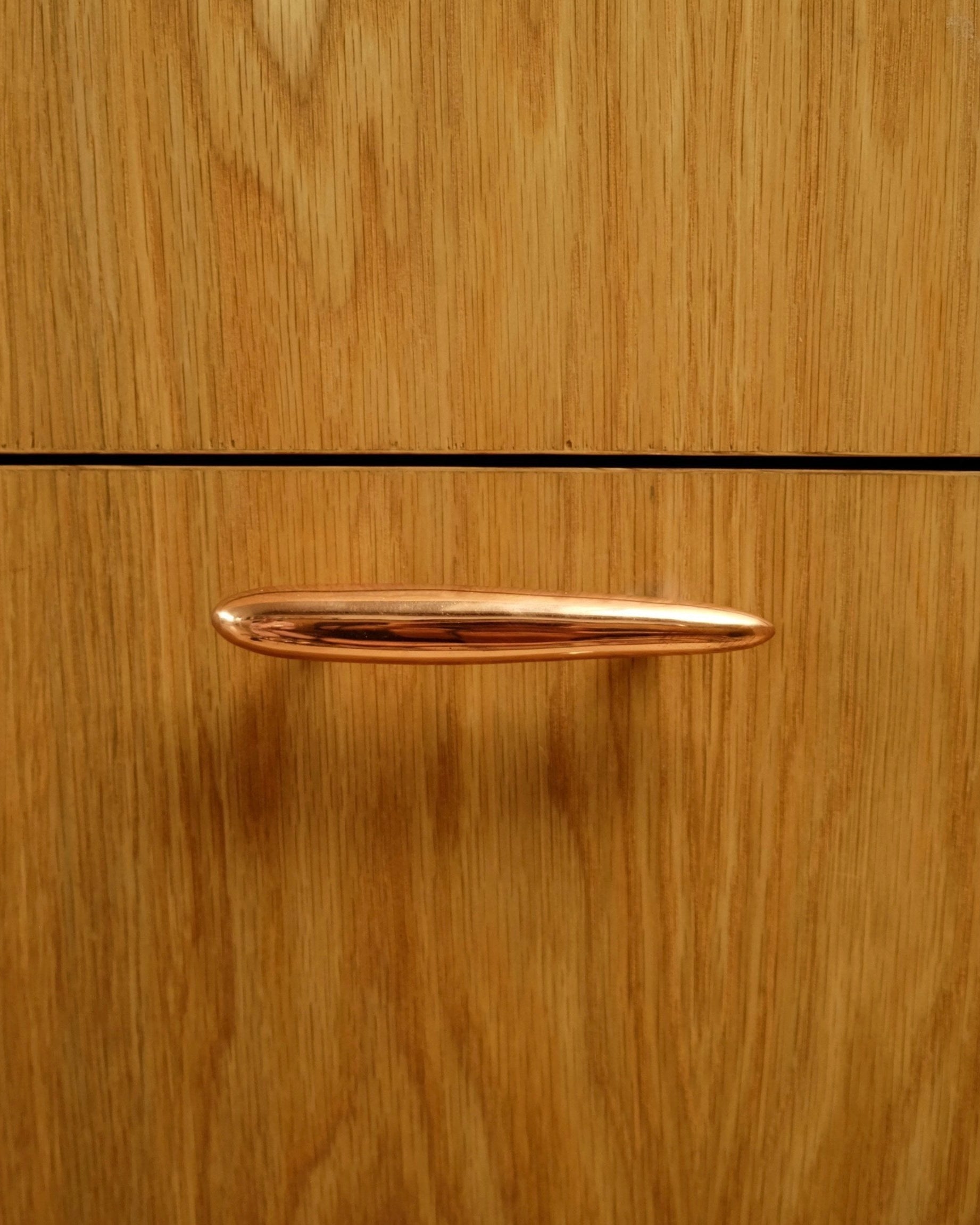 MOMI Cabinet Pull — back view of polished copper knob on wood