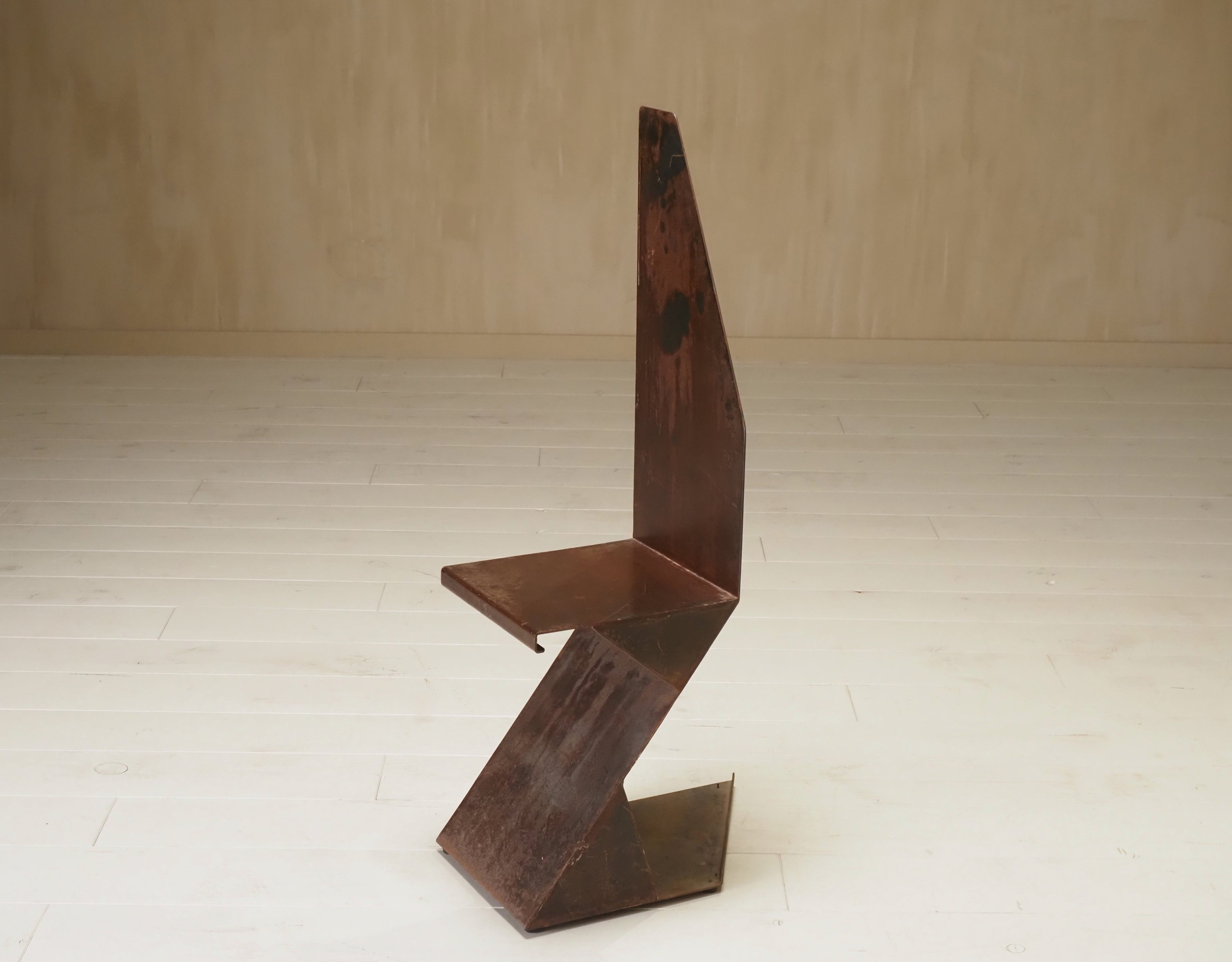 Sculptural postmodernism steel chair — side angle