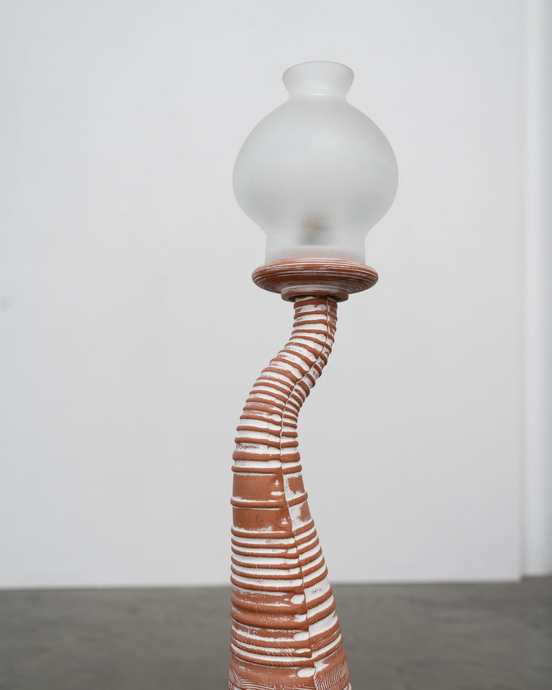 Curved terracotta base detail of vintage sculptural table lamp
