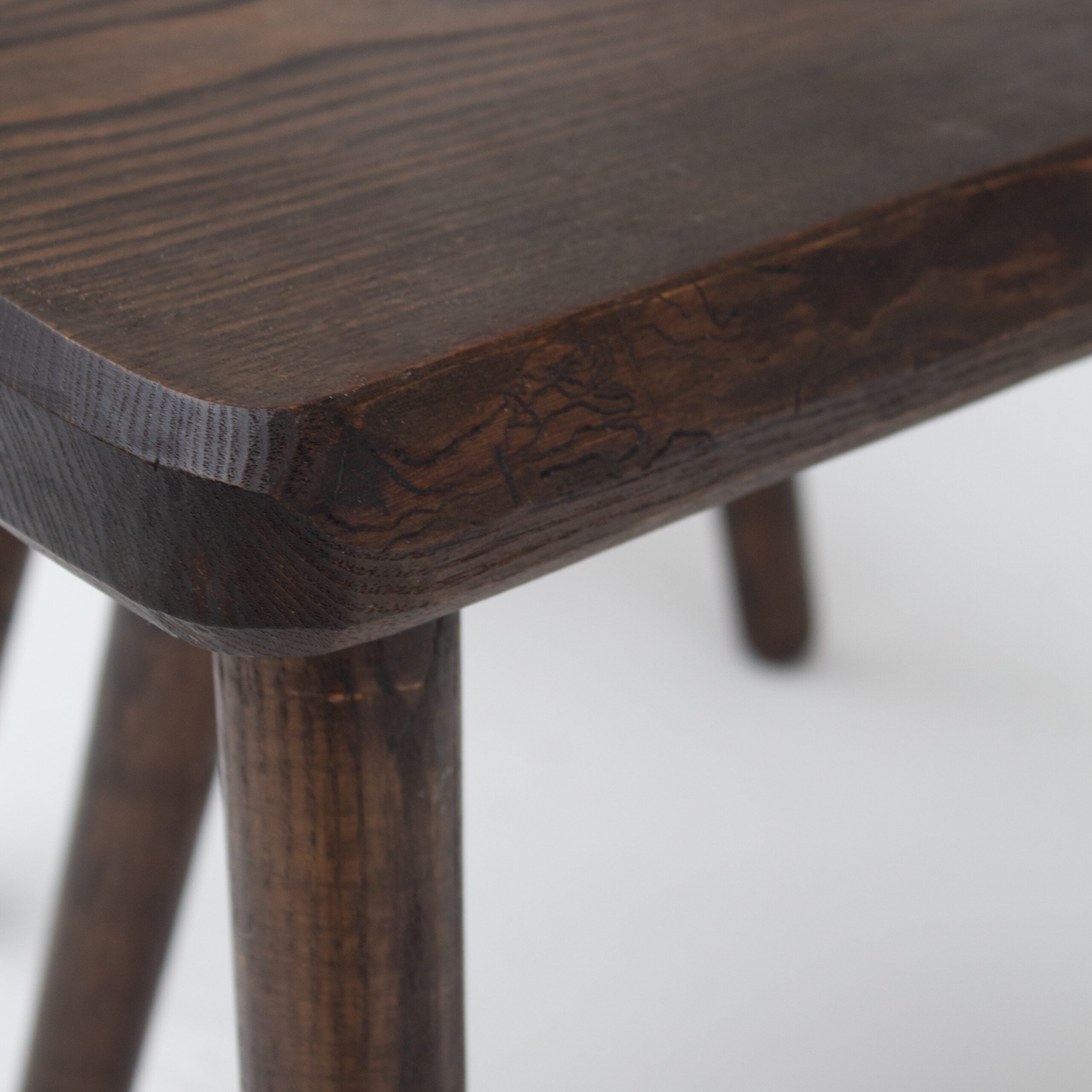 Mid Century Bench and Stools in wood — close-up