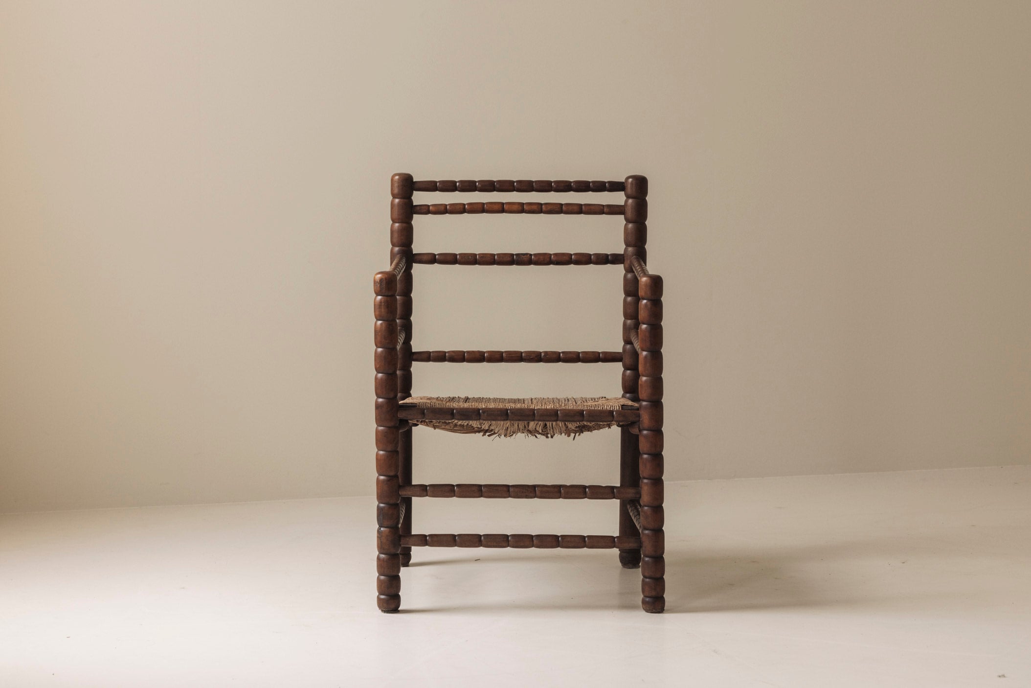 Sculptural French 'Bobbin' armchairs, 1950s — side angle