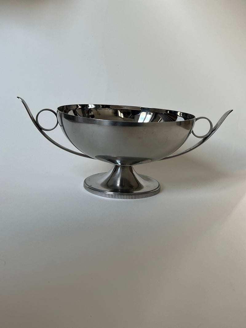 Polished steel decorative bowl with curved handles on pedestal base