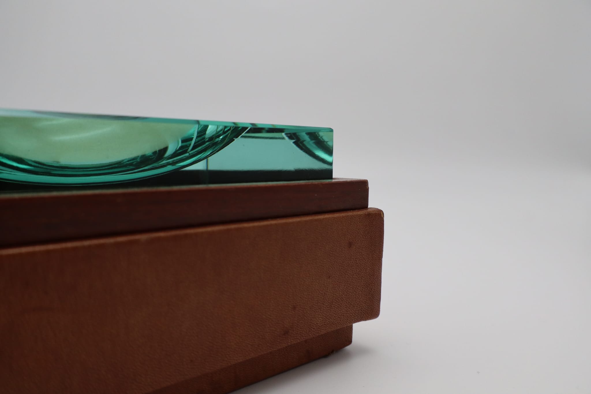 Fontana Arte Nile-Green Crystal Ashtray with Hidden Compartment (c. 1960s–70s) — side angle showing crystal and wooden base