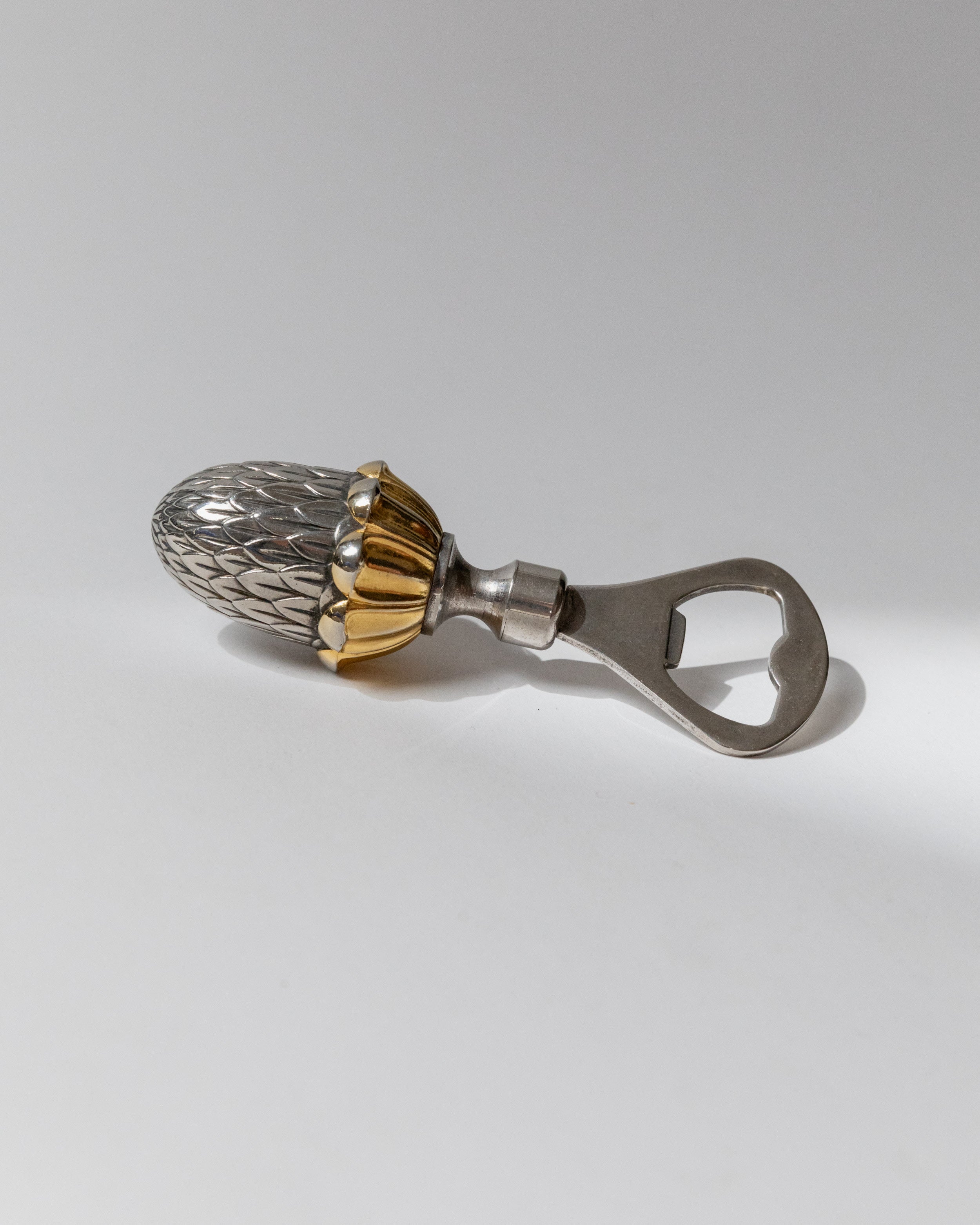 Silver-plated bottle opener with ornate pineapple handle, Italian 80s design