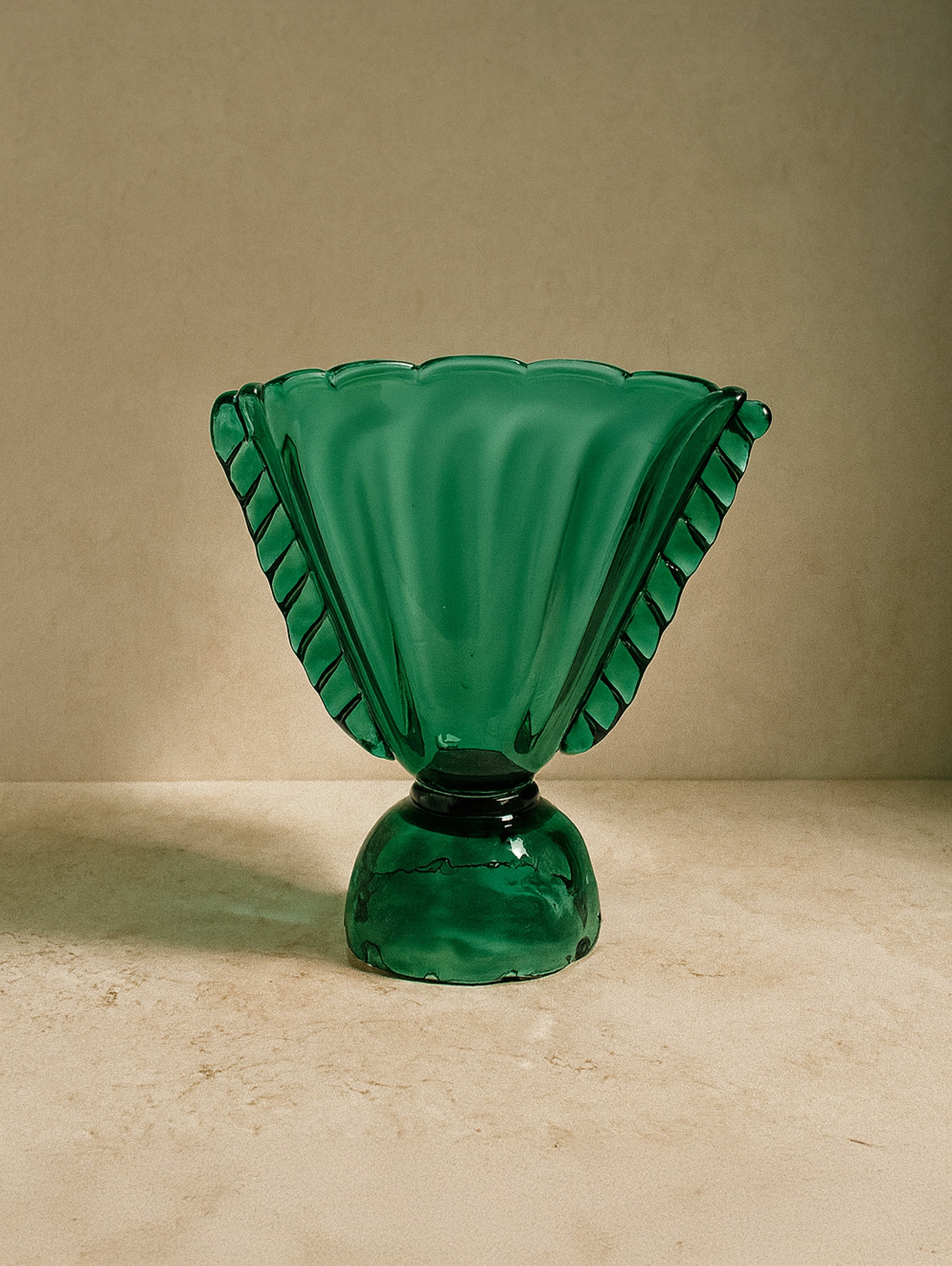 Emerald green glass amphora vase with ribbed handles from 1910s