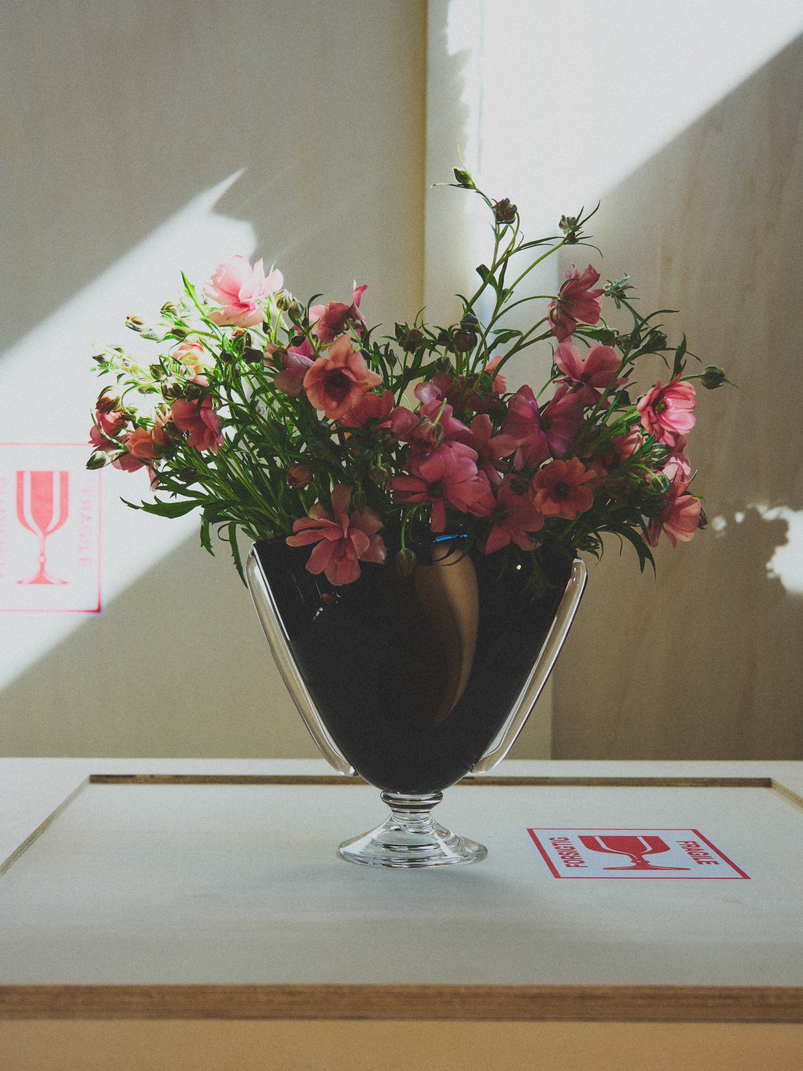 Mouth Blown Karl Vase — close-up of black glass with flowers