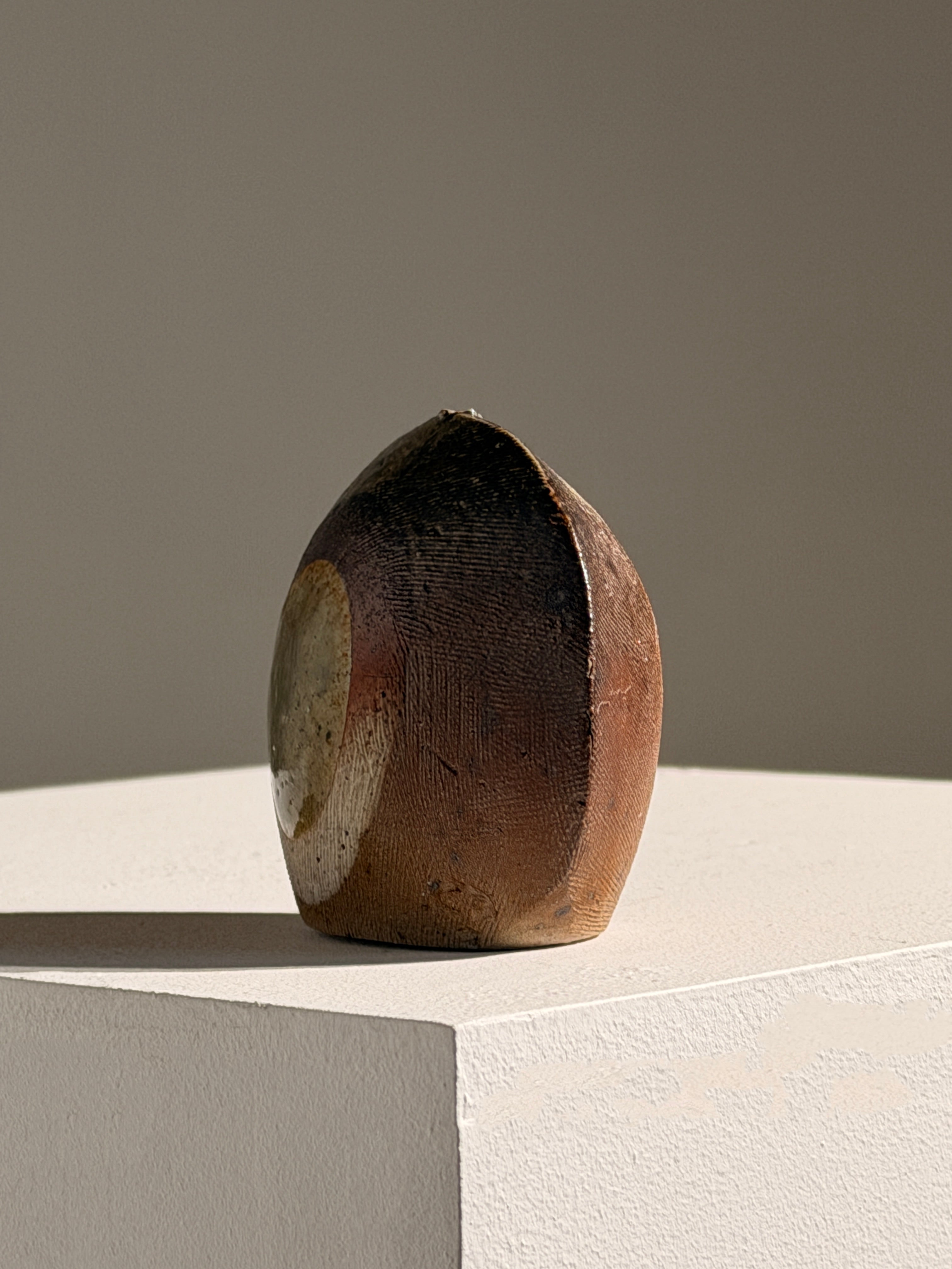 Rare Soliflore Vase by Gustave Tiffoche — angled view on light pedestal