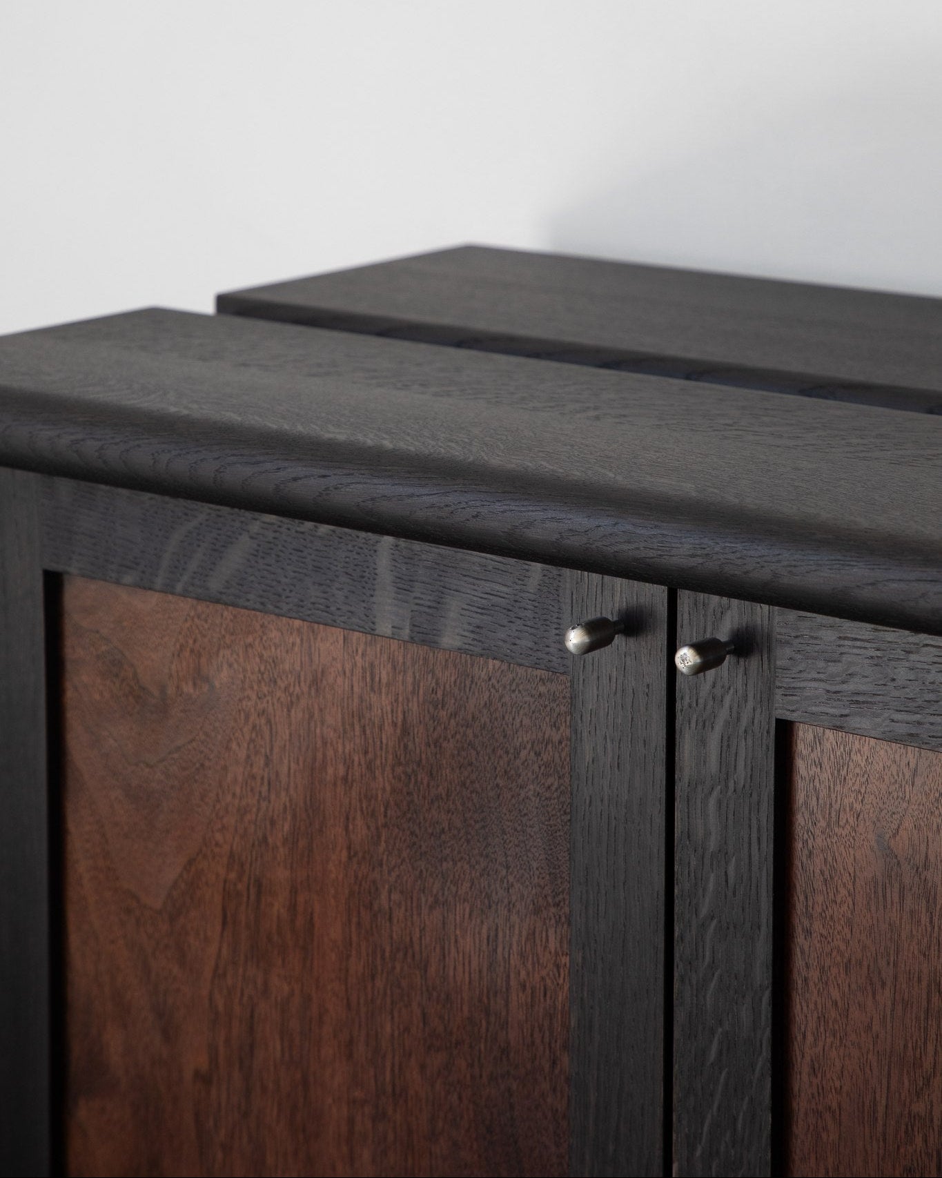 Elwha Cabinet — close-up of dark wood finish and brass knobs