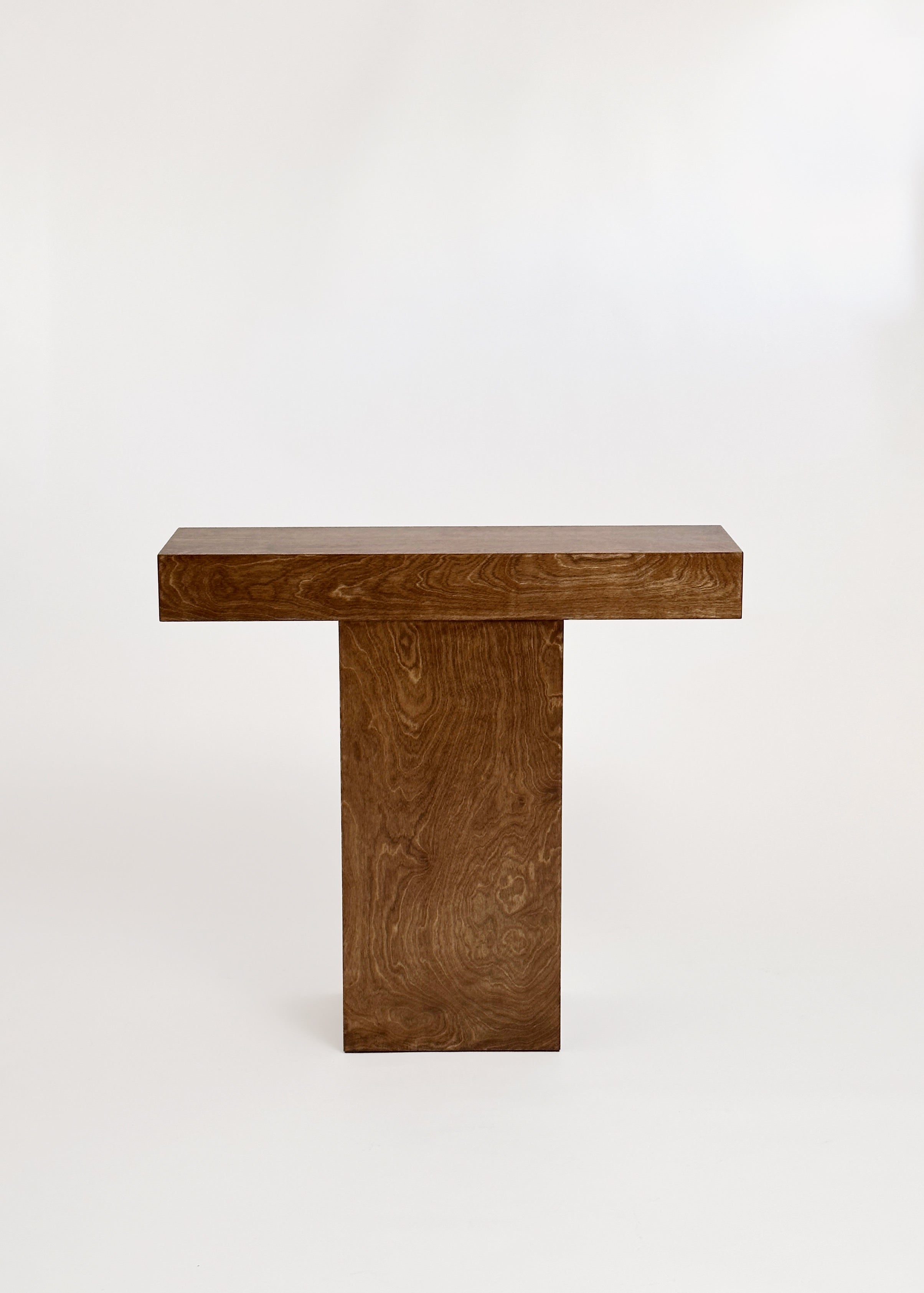 The Truss Console 02 by GOONS, a minimalist T-shaped table designed by the Paris studio GOONS, is showcased against a plain white background.