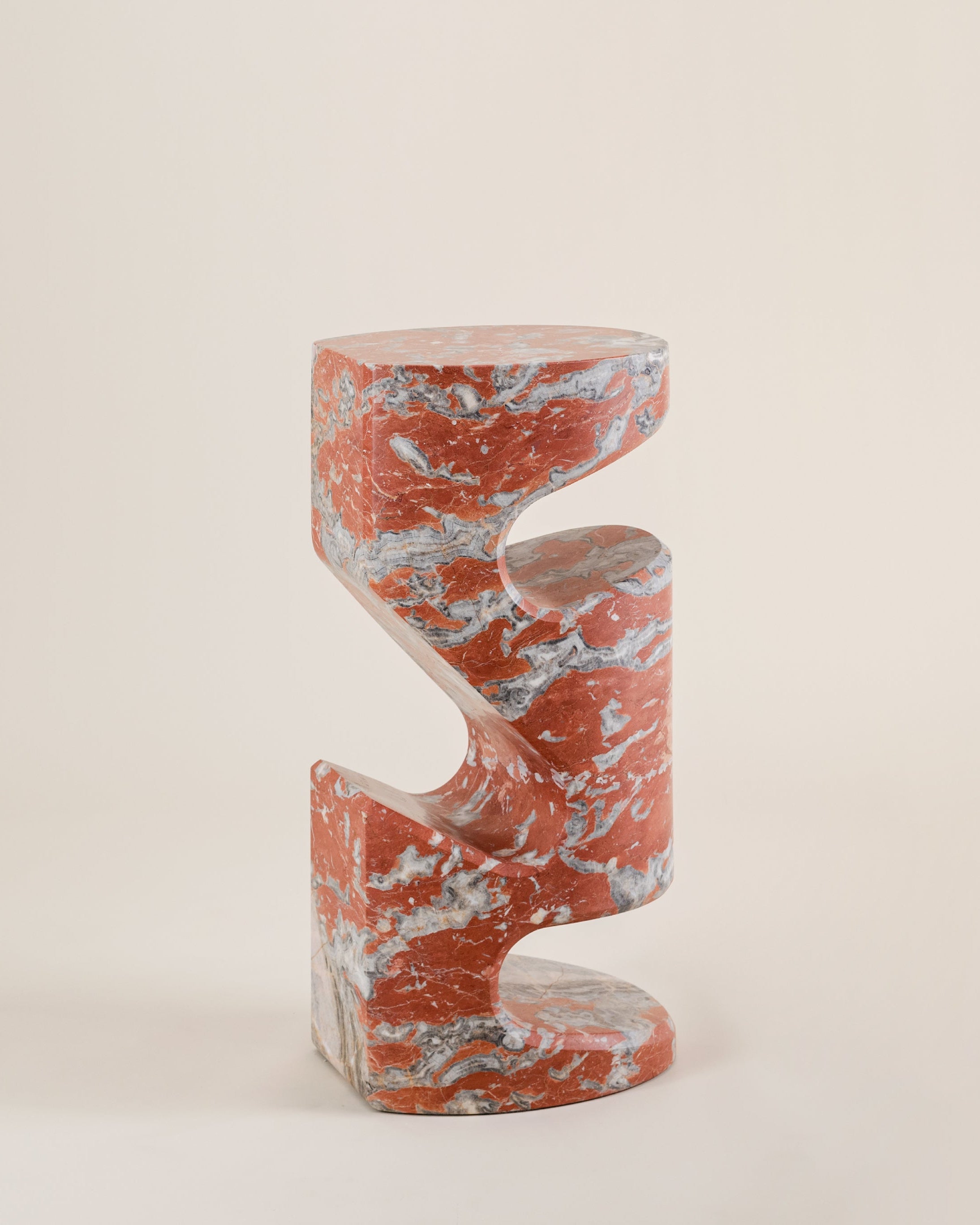 Tobo Side Table — close-up of red marble with blue veining