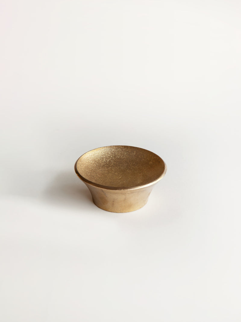 Luna Paper Weight — top view of gold metal surface