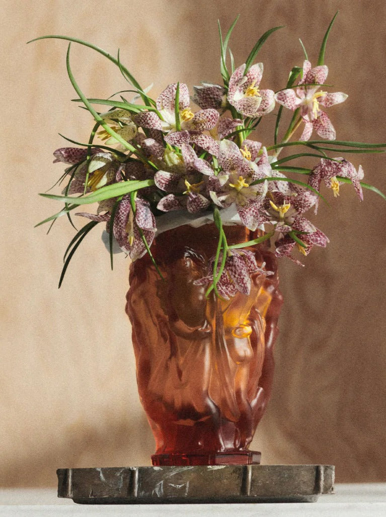 Michael Vase — side angle with amber glass and floral arrangement