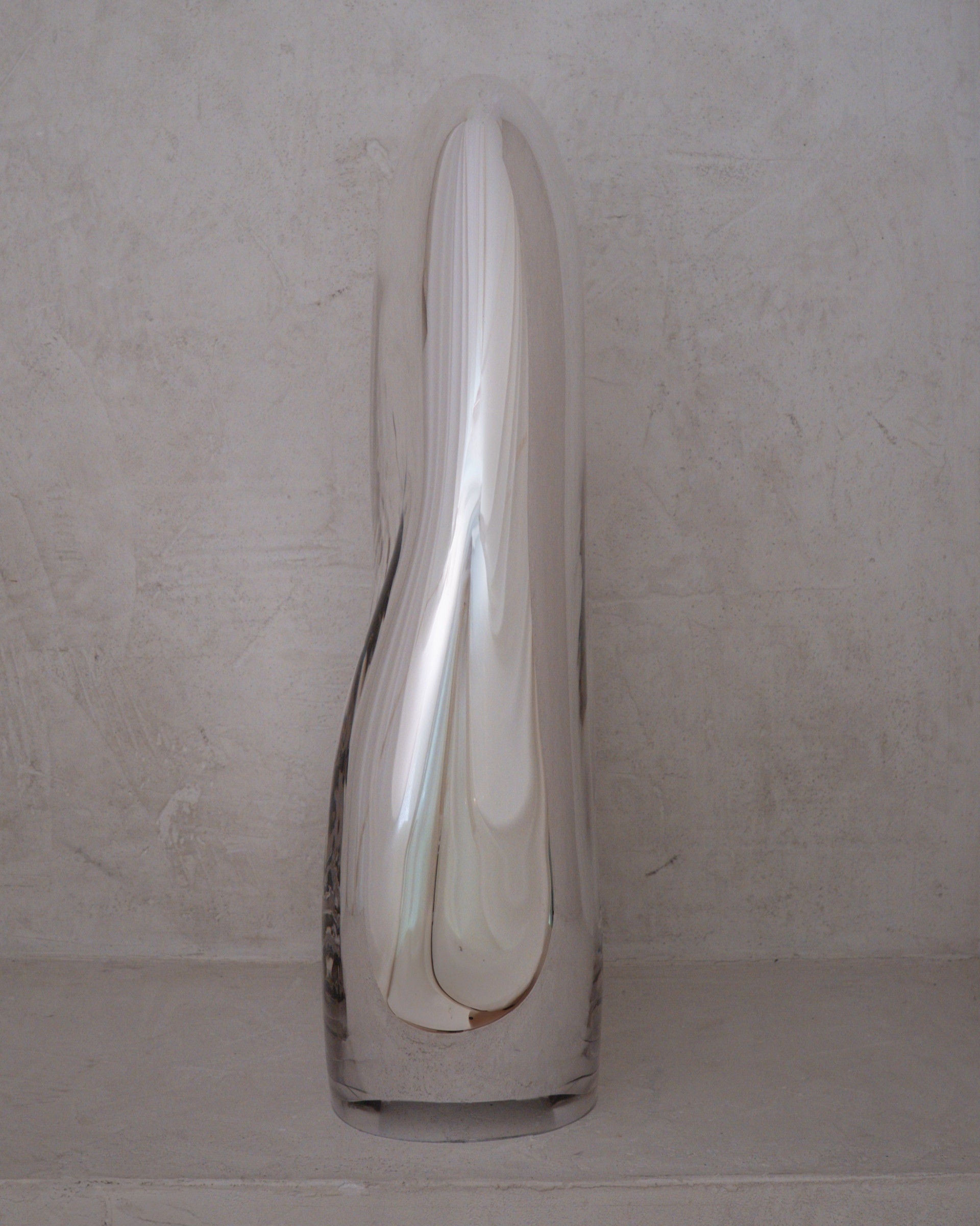 Standing Glass Sculpture - Contemporary Mirror Collection — front view on textured stone surface