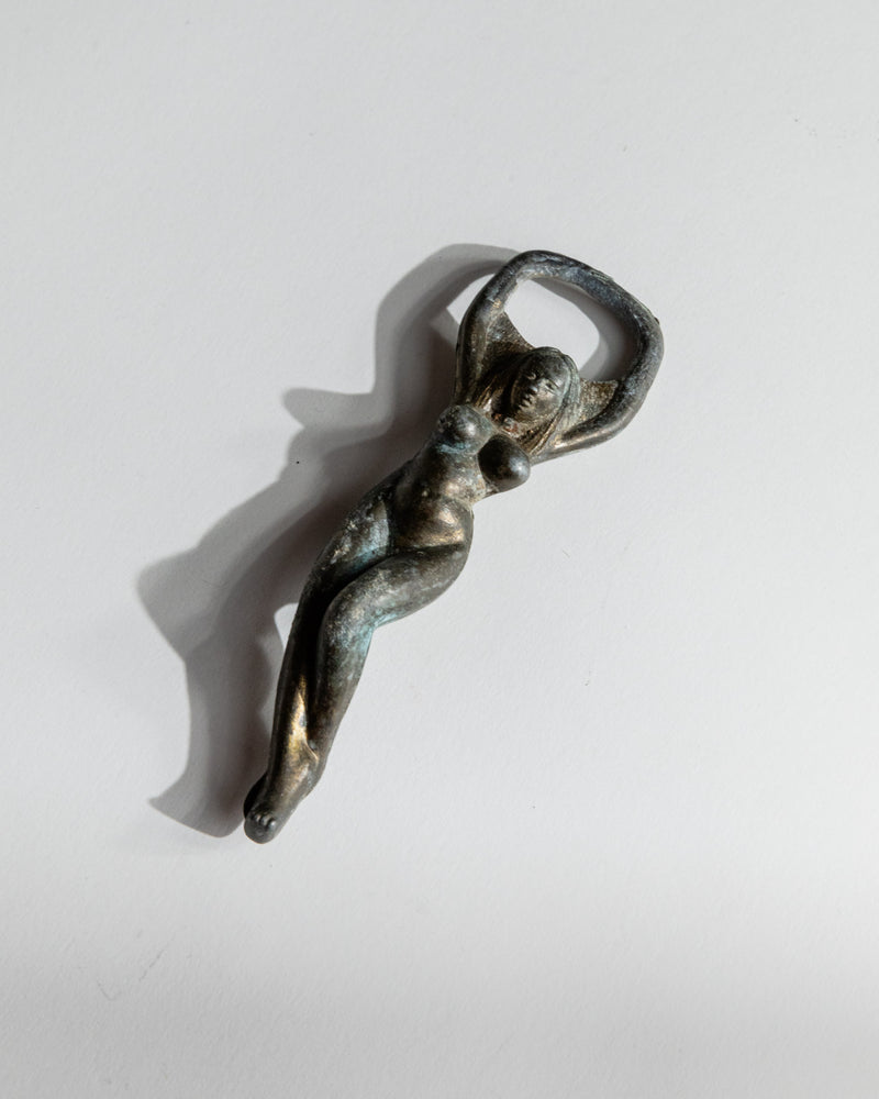 Vintage 1940s Bottle Opener Brass, Nude Woman Shape — close-up showing detailed figure and patina