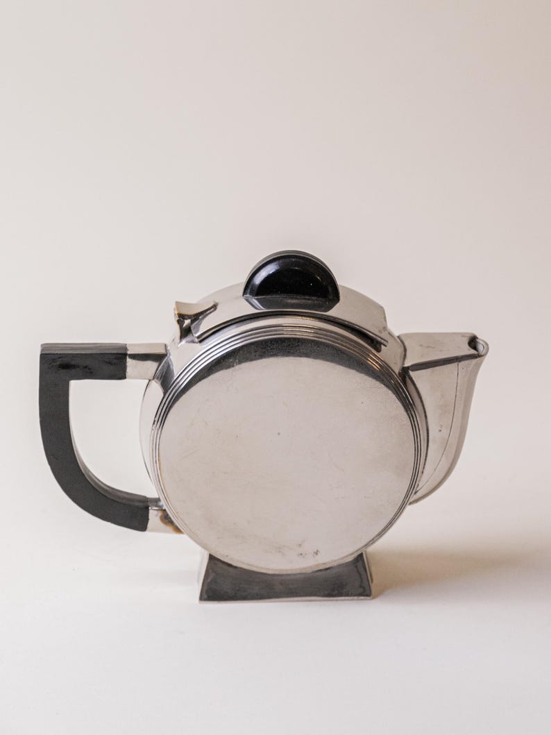 Art Deco Silver Plated Teapot — close-up of polished silver surface