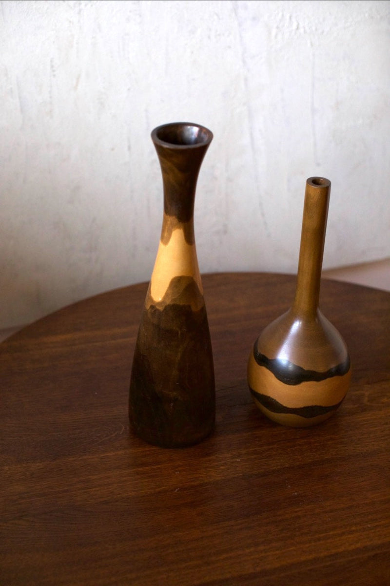 Wooden Vases — close-up of handcrafted wooden vases on wooden table