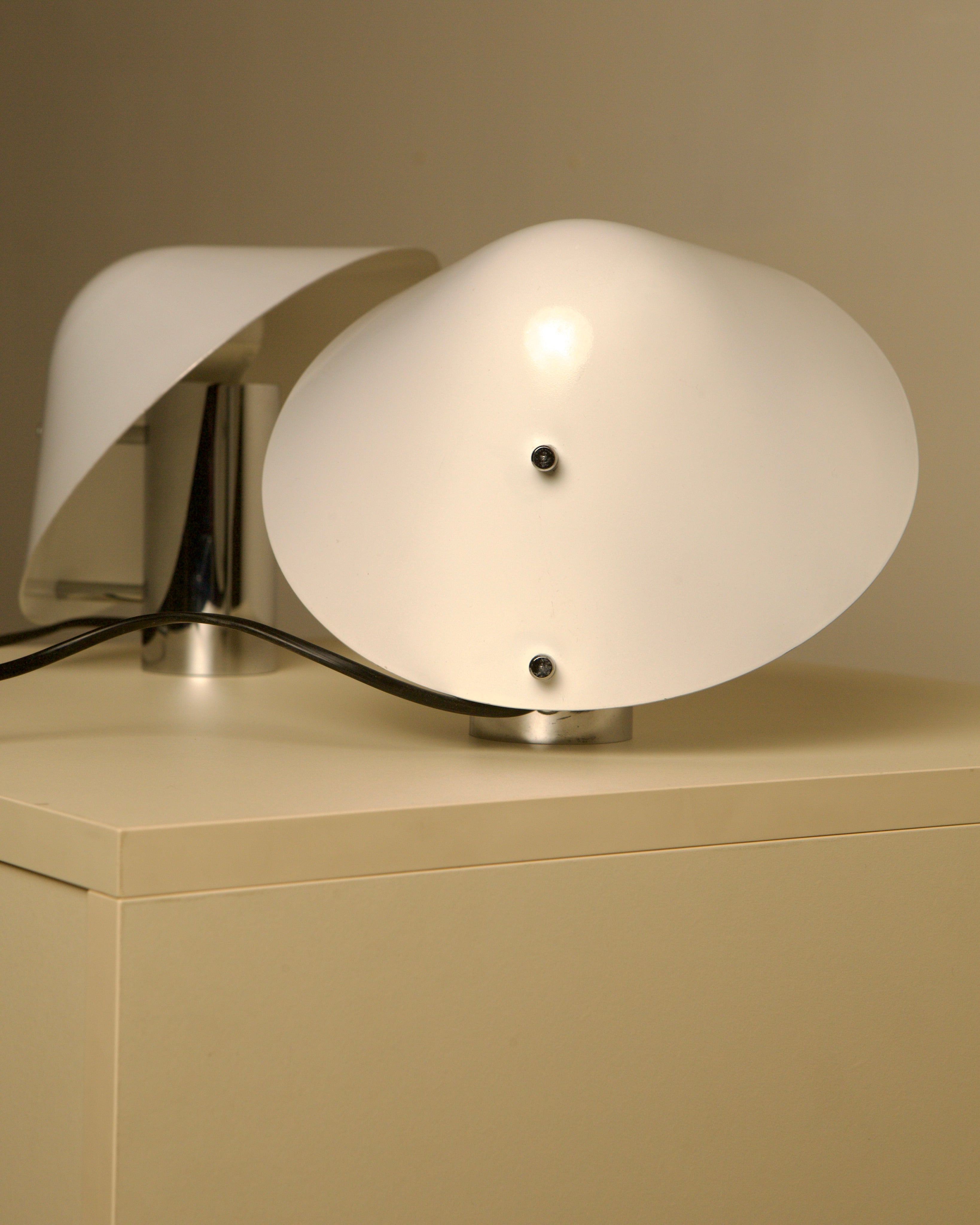 Modern white glass Pulcino table lamps with chrome base detail