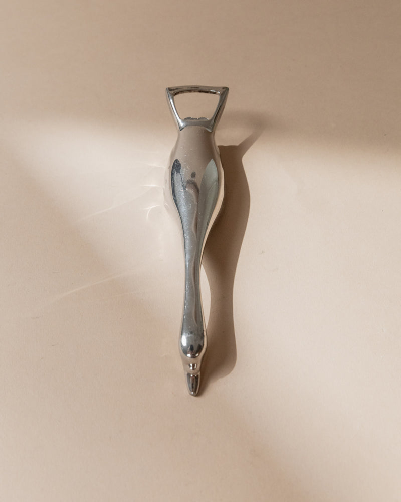 Vintage silver plated bottle opener profile view, Italy 1960s