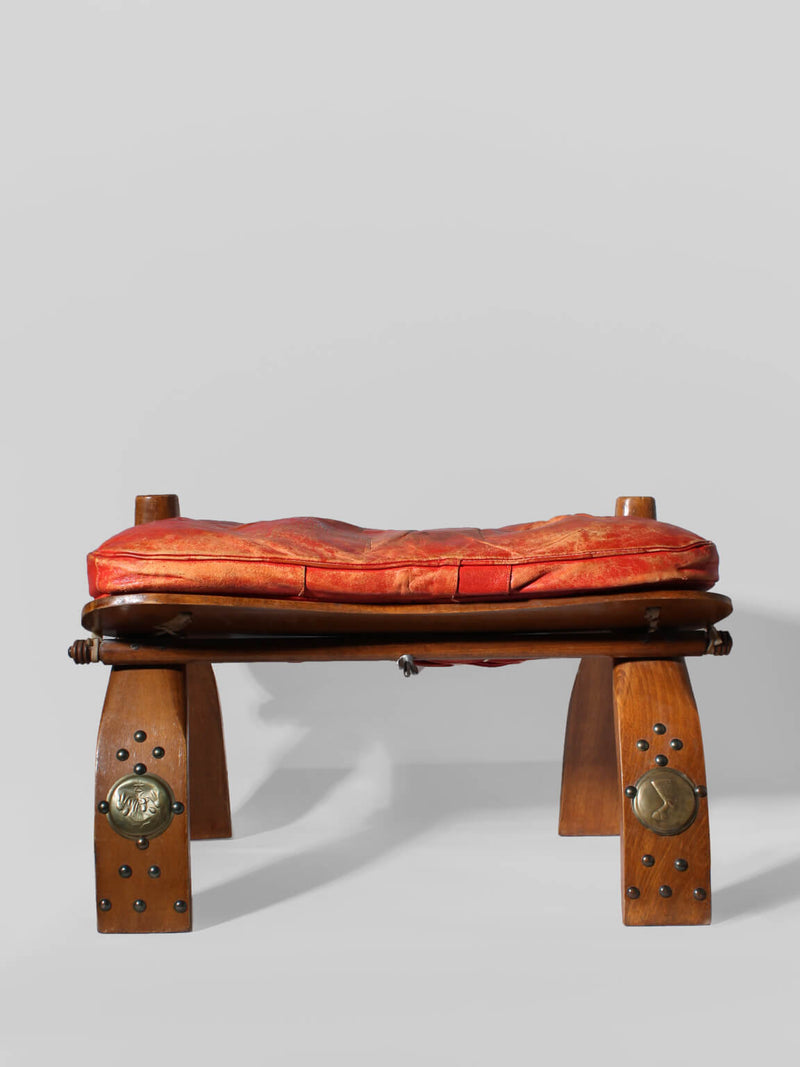 Egyptian Ottoman Camel Saddle Stool by Vintage Stories | The Oblist — handcrafted wood and red fabric