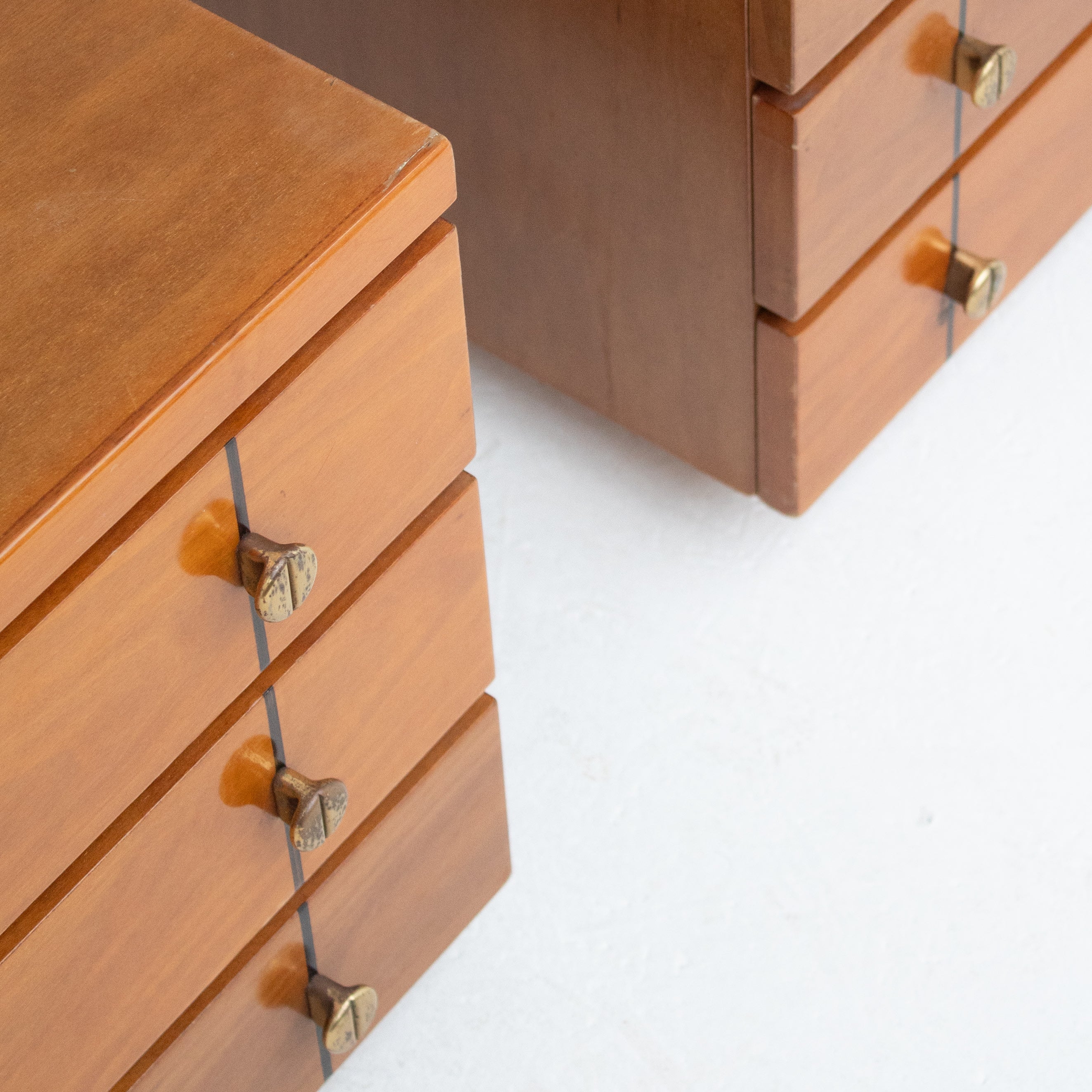 Set of Mid Century Nightstands in Wood — side angle showing wooden drawers and brass knobs