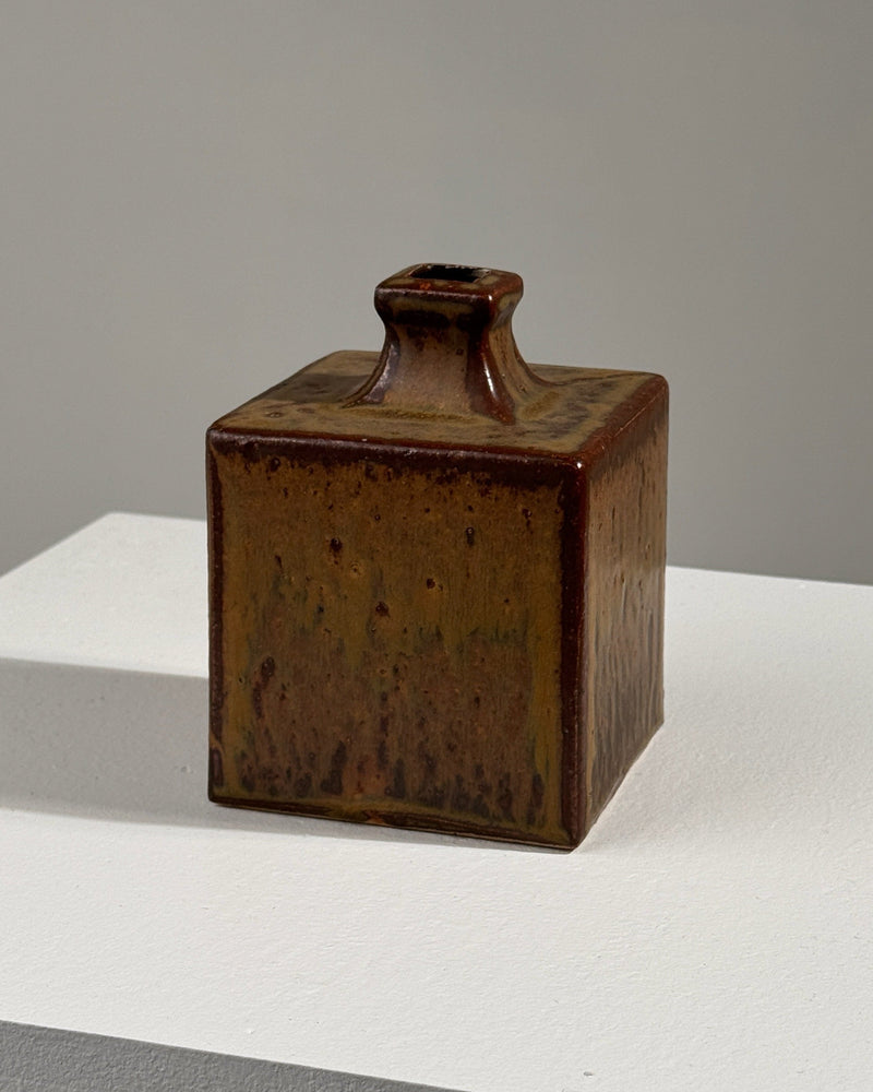 Brown glazed ceramic square vase with textured finish and neck spout