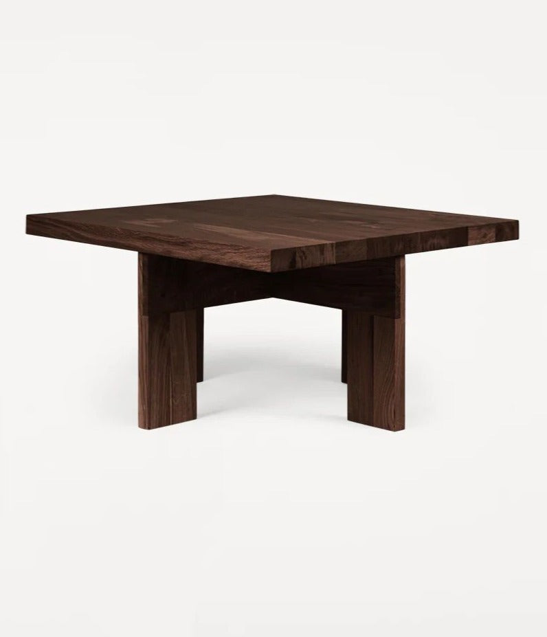 The FRAMA Farmhouse Coffee Table features a square shape, dark oak finish, and minimalist modern design with thick legs, shown against a plain white background.