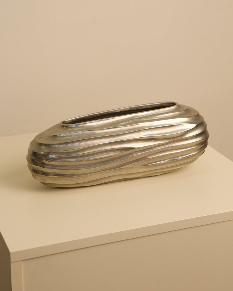 Ribbed aluminum vase profile showing horizontal grooved texture
