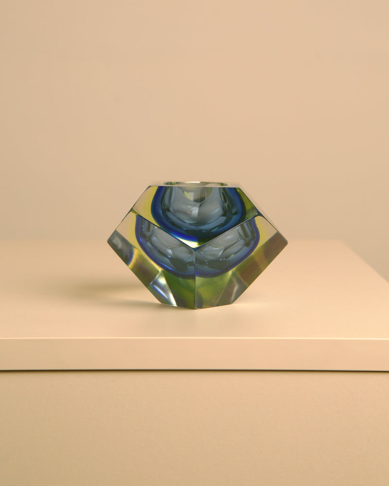 Diamond-shaped blue Murano glass vide poche showing geometric facets