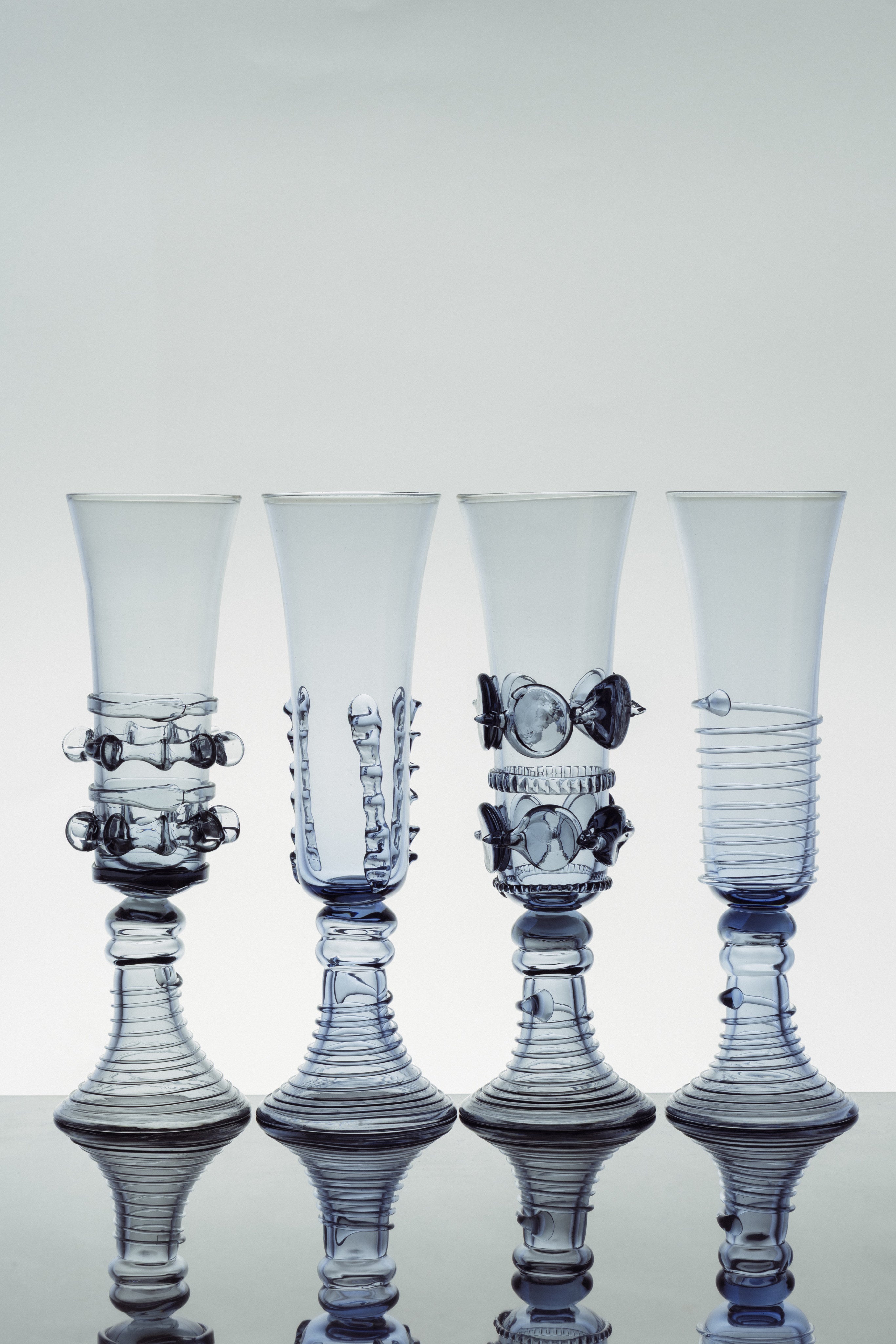 Mouthblown Champagne Coupe & Flute - Set of Four — close-up of blue glass details