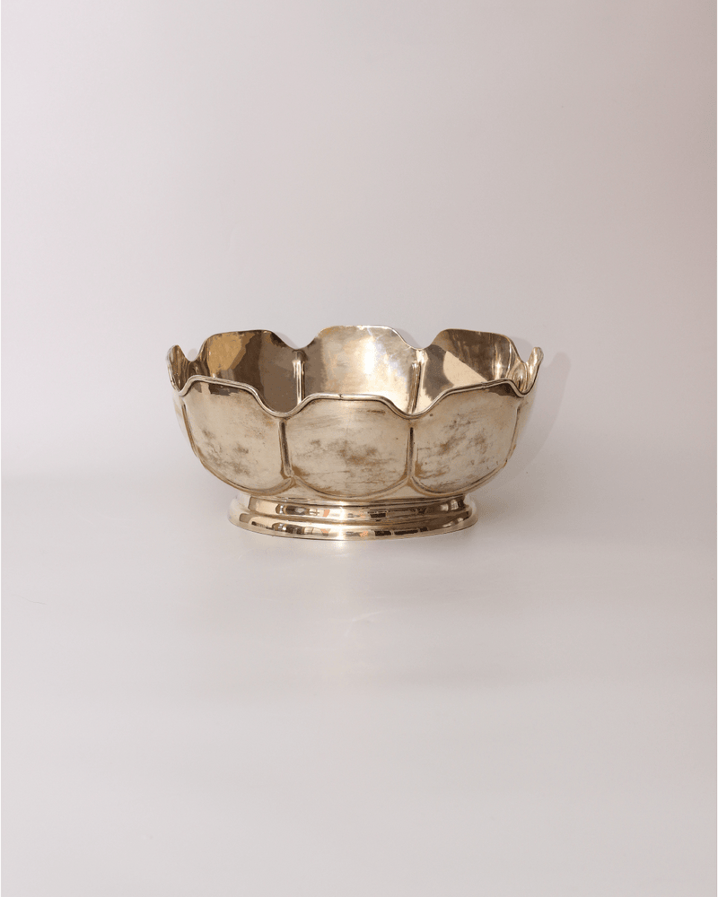 Silver Bowl — close-up of polished silver surface with scalloped edges