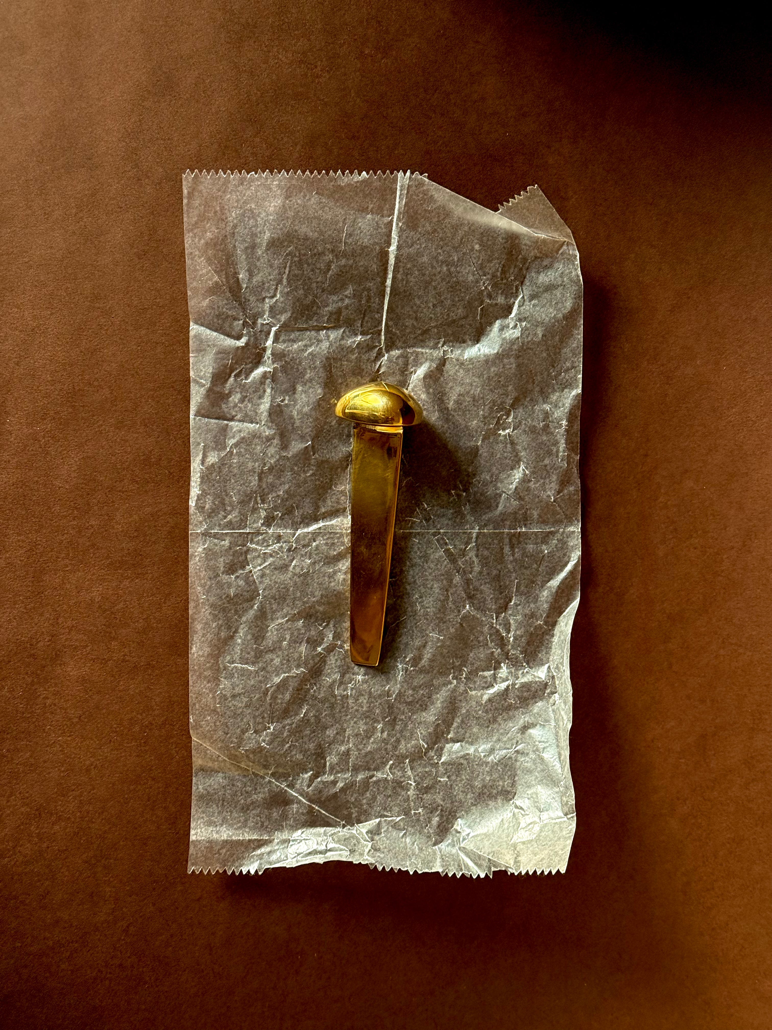 MOMI Bookmark No. 1 — top view on crumpled paper background