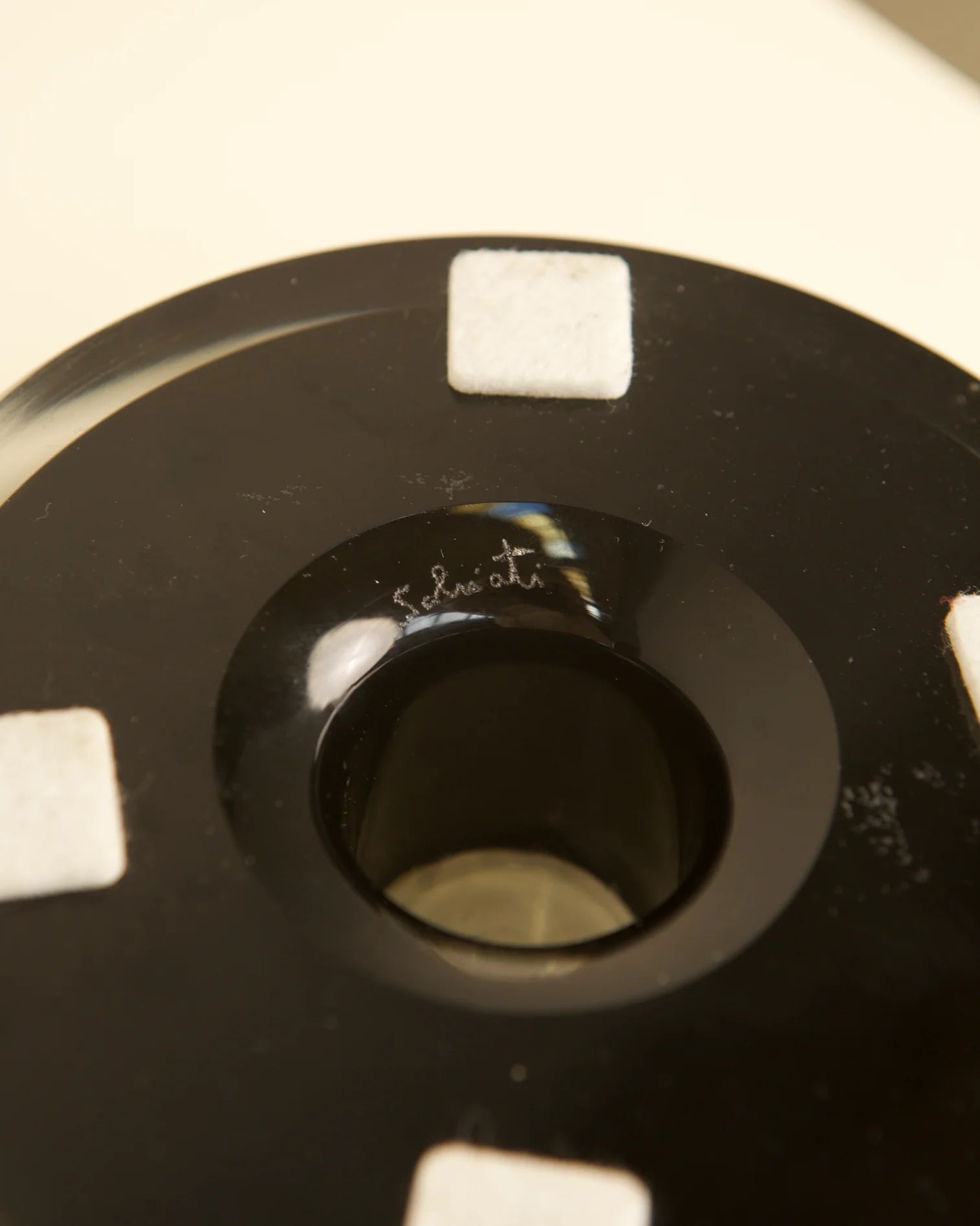 Black Murano glass vide-poche interior detail showing curved bottom