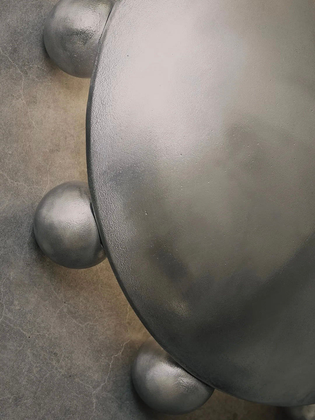 ALTER Sconce | Aluminium — top view highlighting rounded metallic details