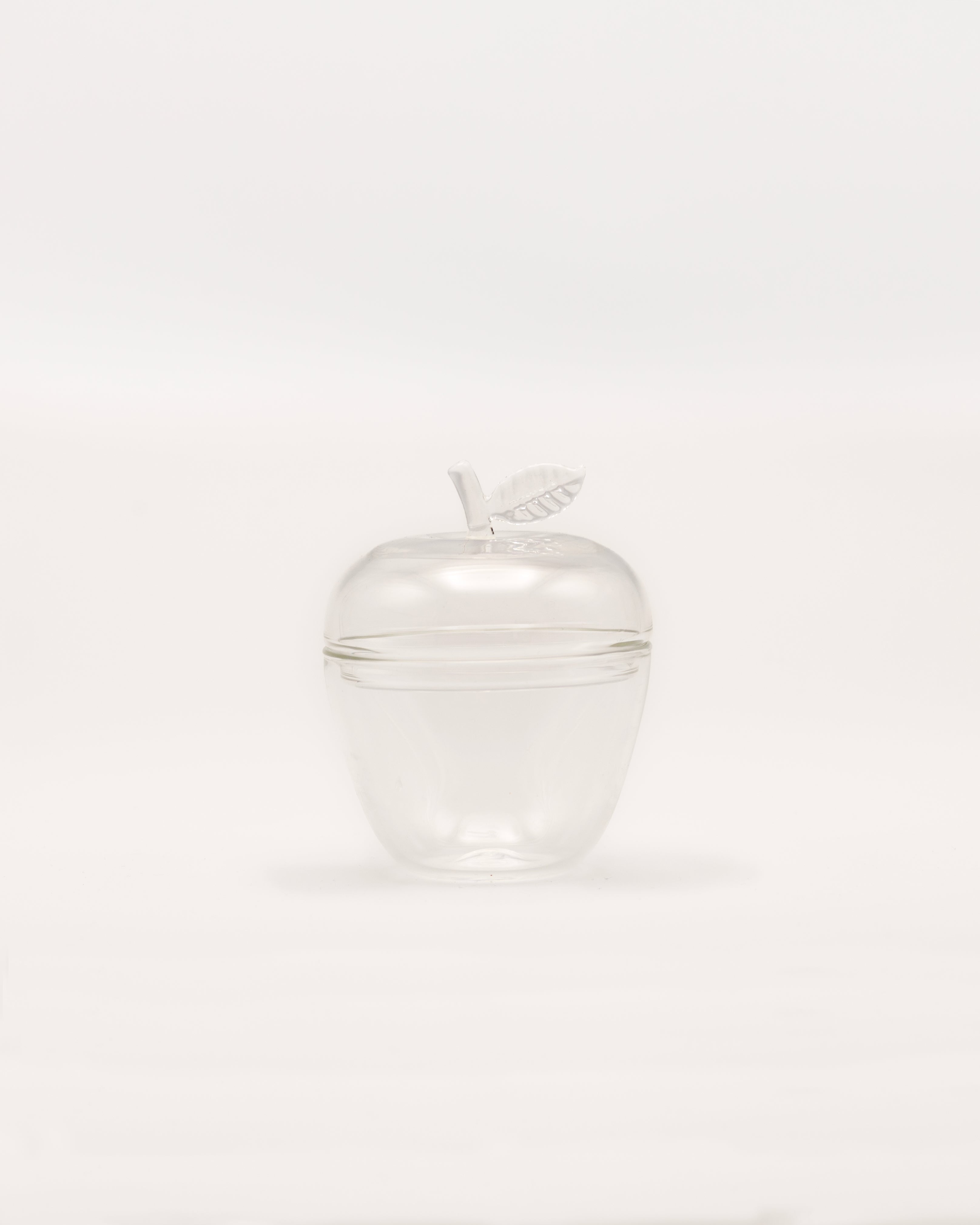La Pomme — clear glass apple container with leaf detail