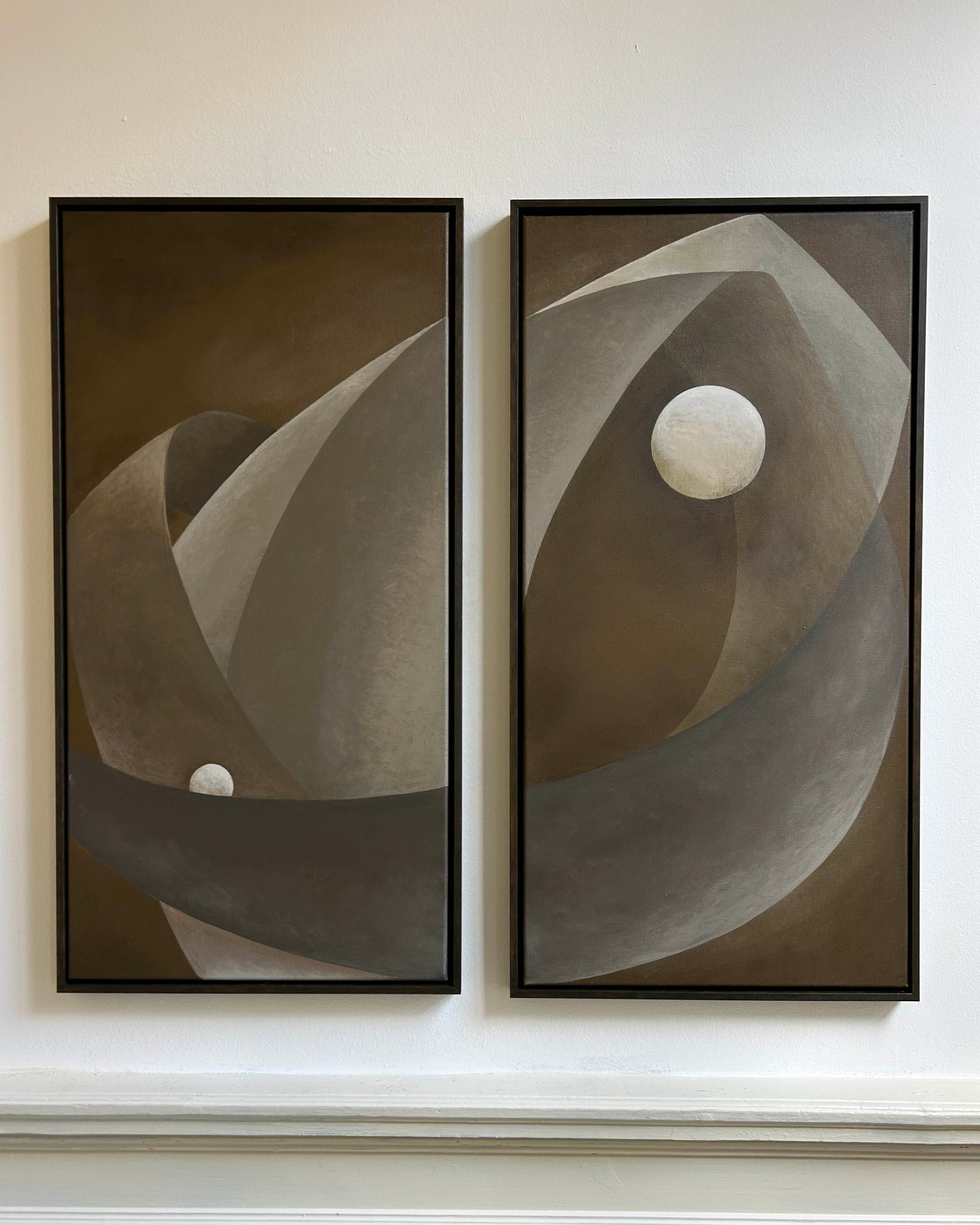 ‘You only live twice’ Painting by Iris Bavelaar features two framed rectangular canvases with overlapping curved shapes in brown and gray, accented by a white circle—contemporary wall art perfect for modern spaces.