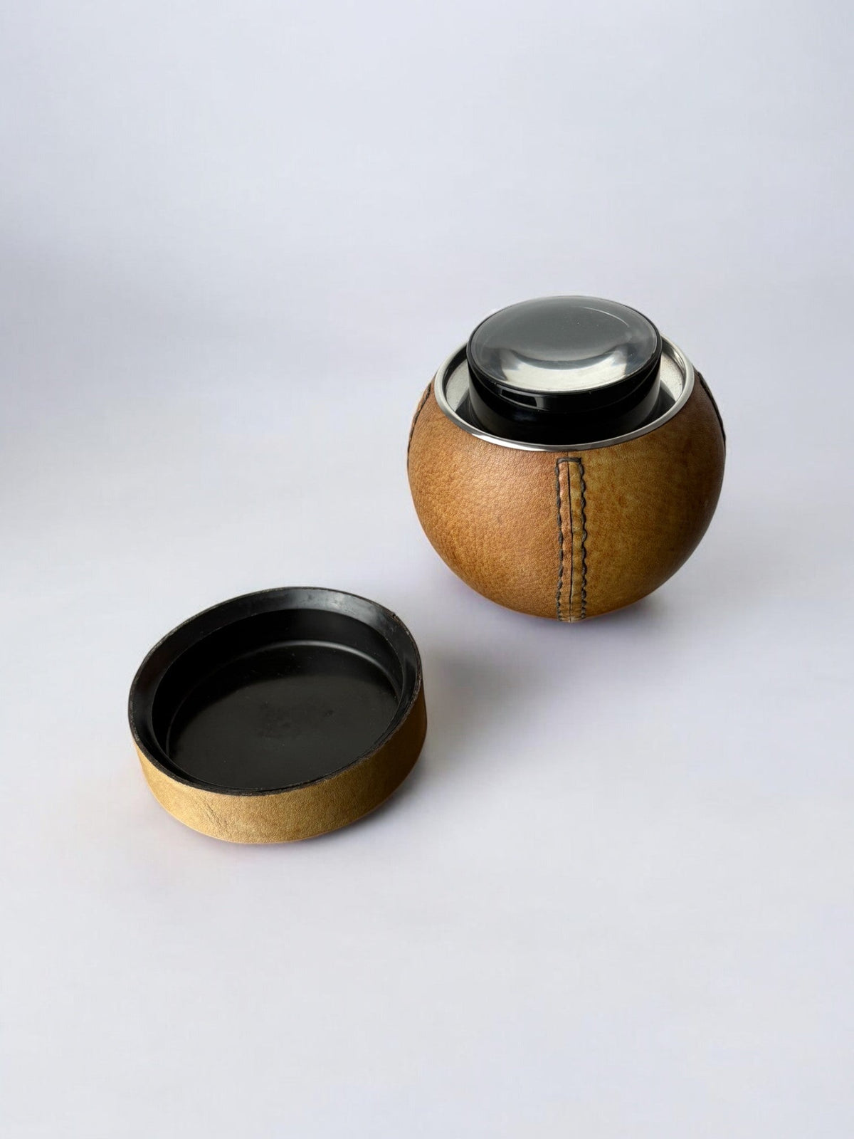 Circular cigarette box with support in leather, Spain, 1980's — lifestyle setting