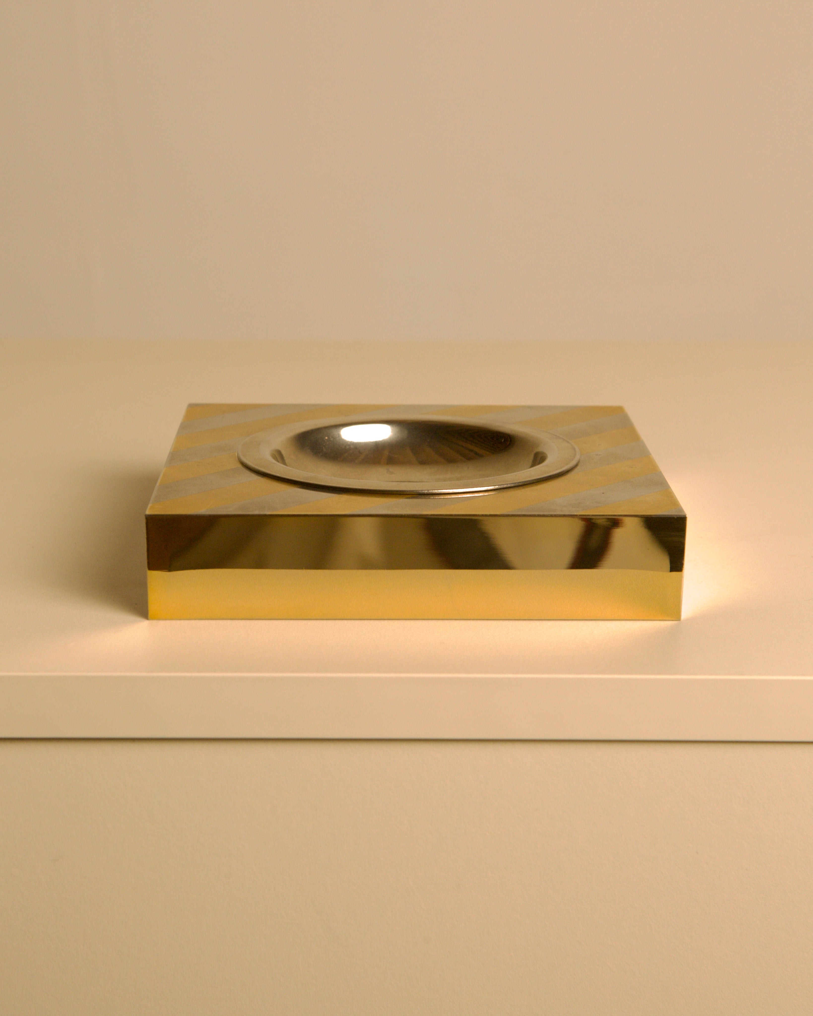 Holywood Regency Silver-plated Metal Vide-poche 70s — side angle on white surface