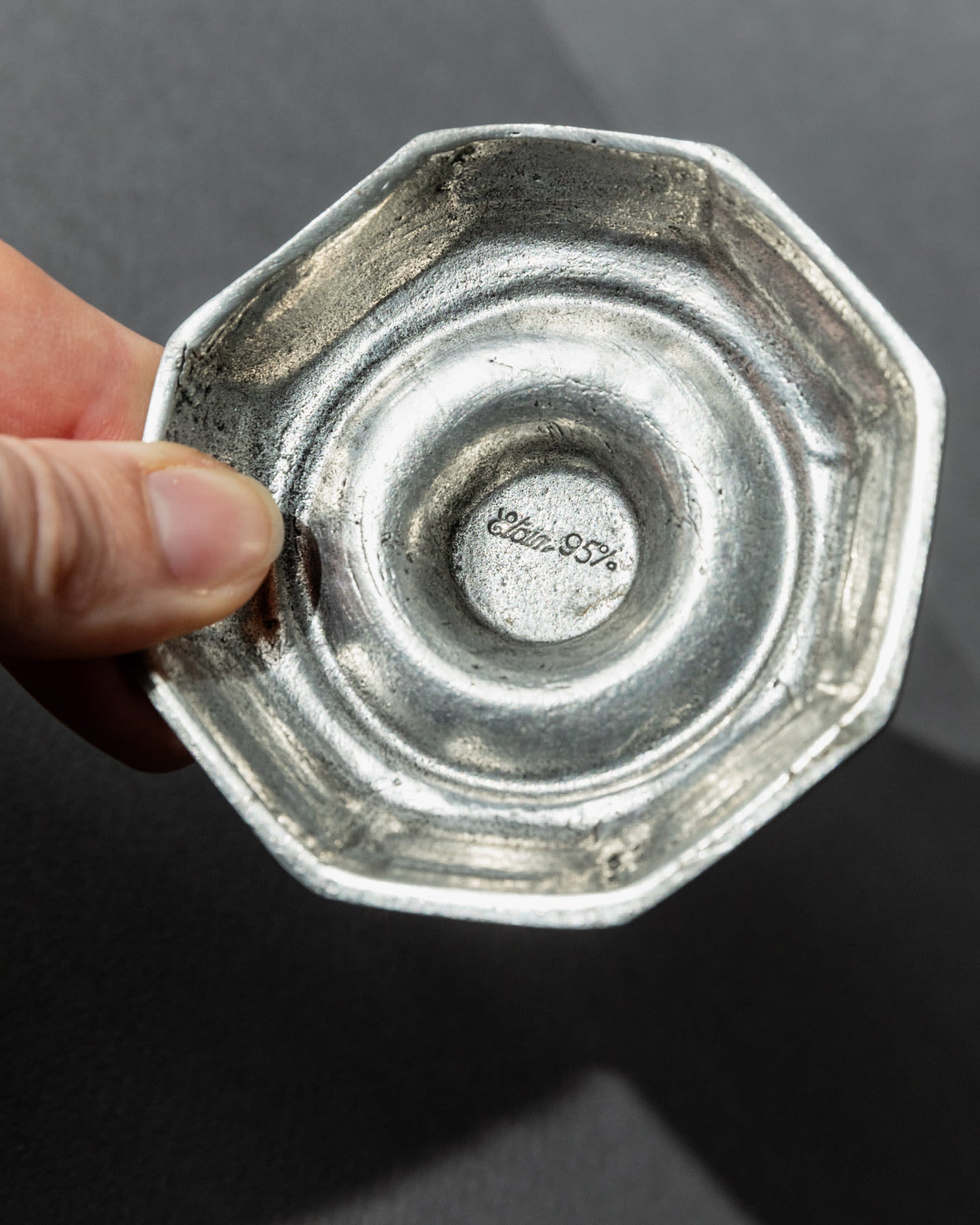 1900s Pewter Candleholders Set of 2 — close-up of textured pewter base