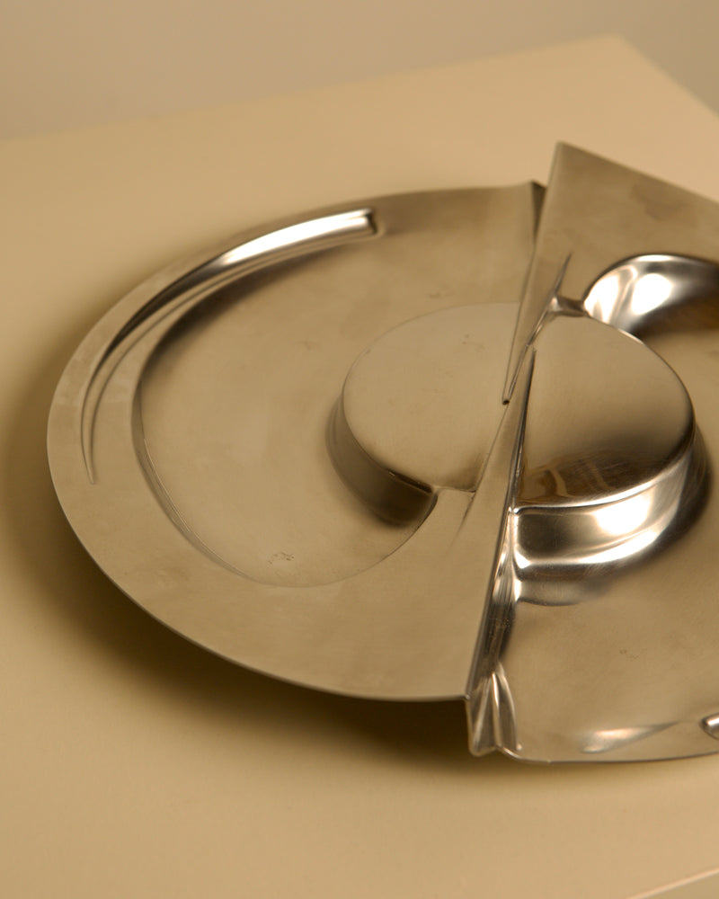 Large metal storage compartment 'Forma Orizzontale Circolare' by Carmelo Cappello for Ales — close-up of polished stainless s