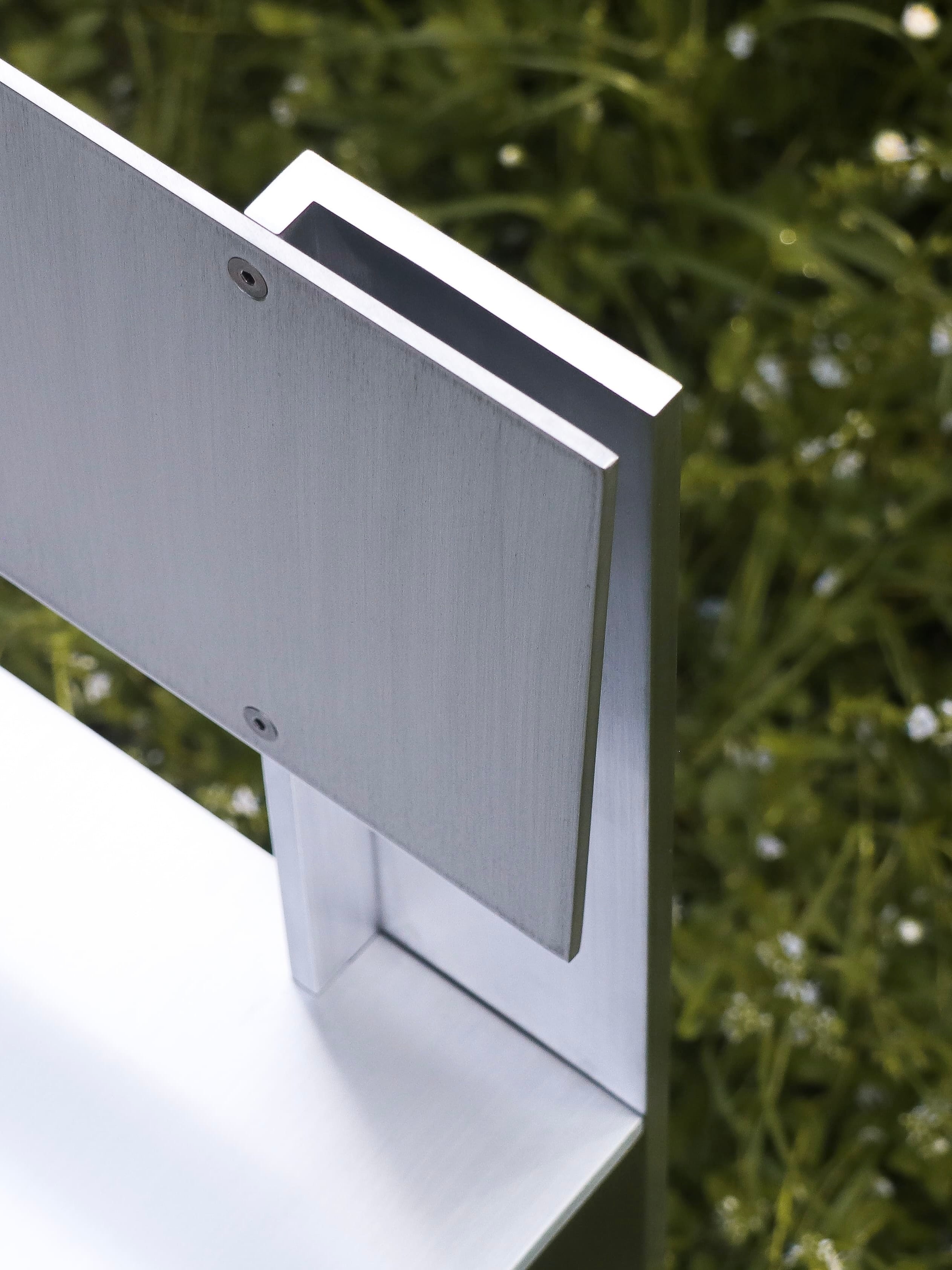 AL Chair — back view highlighting brushed aluminum finish
