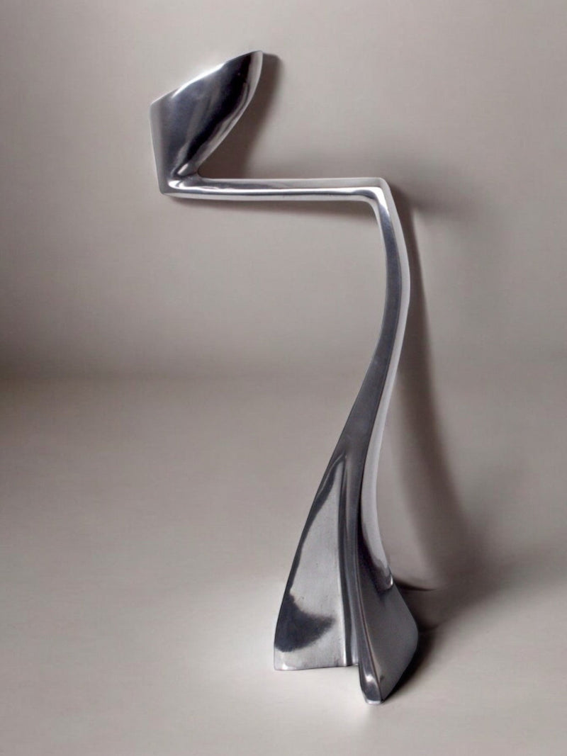 Swan Candleholder by Matthew Hilton, England, 1980 — close-up of polished metal surface