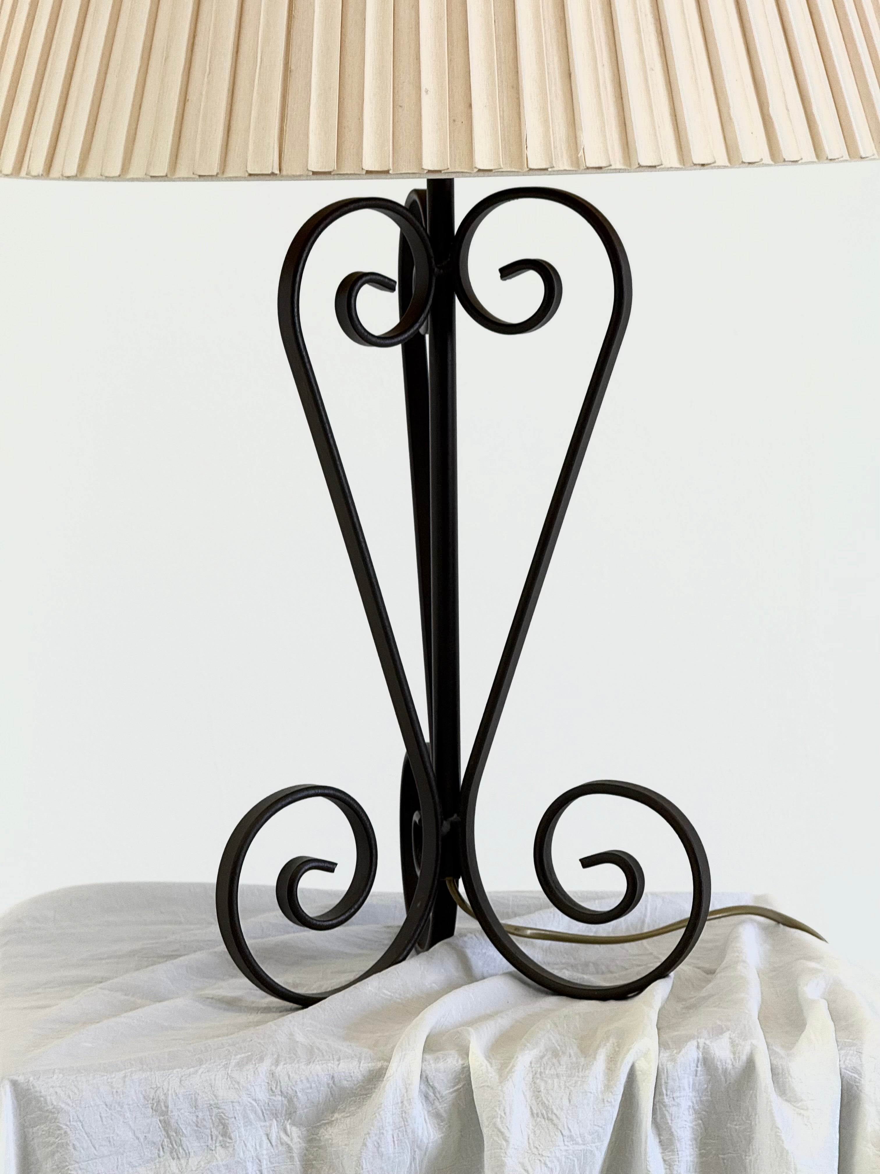 Vintage wrought iron table lamp in a swirl shape with a pleated shade — additional view