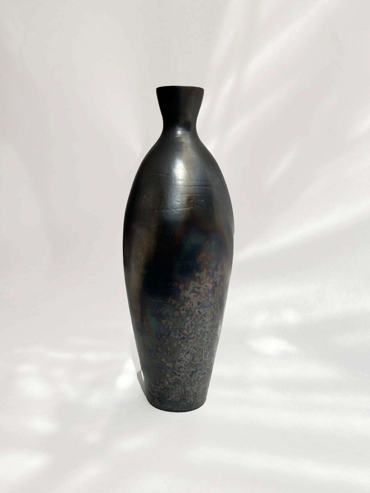Oleum Vase – Metallic Black Raku — in context