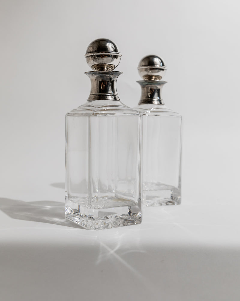 Two vintage glass decanters with silver stoppers, 1950s design
