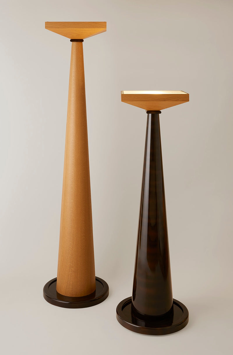 Two modern wooden floor lamps with conical bases and geometric tops